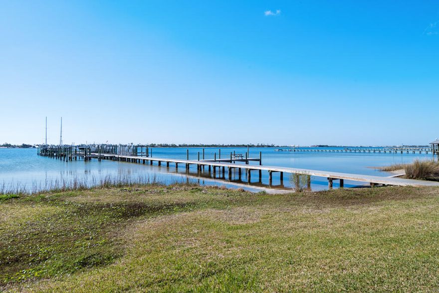 Whether you're looking for your next short or long term investment property, or you're a boater looking for your own waterfront getaway - this 2 bedroom, 1.5 bath townhome in La Mar West Townhomes in Mary Esther is waiting for you! The WATERFRONT community of La Mar West Townhomes features a community pool, tennis courts, clubhouse, boat dock, and a small, private beach for owners and guests - perfect for kids, kayaking, fishing, and more! Ownership for this unit includes your very own deeded BOAT SLIP! Perfect for taking off into the Sound to head out to the Gulf for a nice outing or fishing trip! This furnished and updated 2 story unit features a washer and dryer, 2022 Water Heater, 2023 Roof, 2023 HVAC, and tiled and LVP flooring throughout. The sliding glass door leads to the patio with a fantastic view of the community pool.Upstairs is the full bathroom, spare bedroom, and primary bedroom with its own private balcony to relax and enjoy your morning cup of coffee with a wonderful view. This unit is also equipped with an Electric Vehicle charging plug out front by the 2 assigned parking spaces. Schedule your showing today, and make this FANTASTIC property yours!