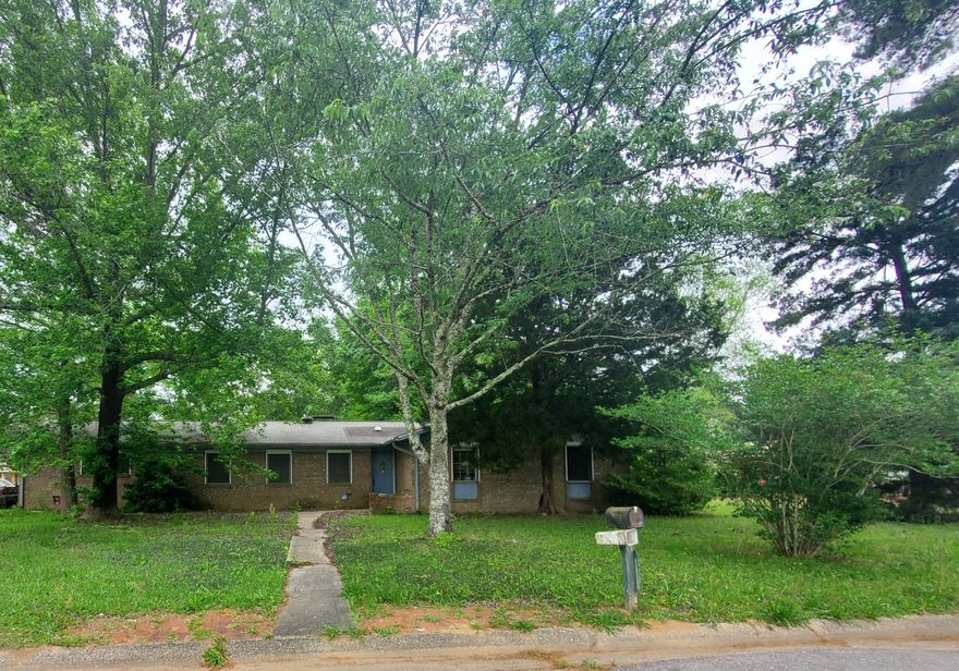 CALLING ALL INVESTORS! FANTASCTIC FIXER UPPER Opportunity in Convenient to Area College,  Airport,  Shopping, I-110.  Corner Lot. Home features side entry garage, formal living room , formal dining room, family room, wood burning fireplace, 3 Solar Tube Lights, kitchen, breakfast bar, two closets in master bath, large 2 Car garage with outside entry door, large yard. This property is distressed and in need of some repairs and updates.