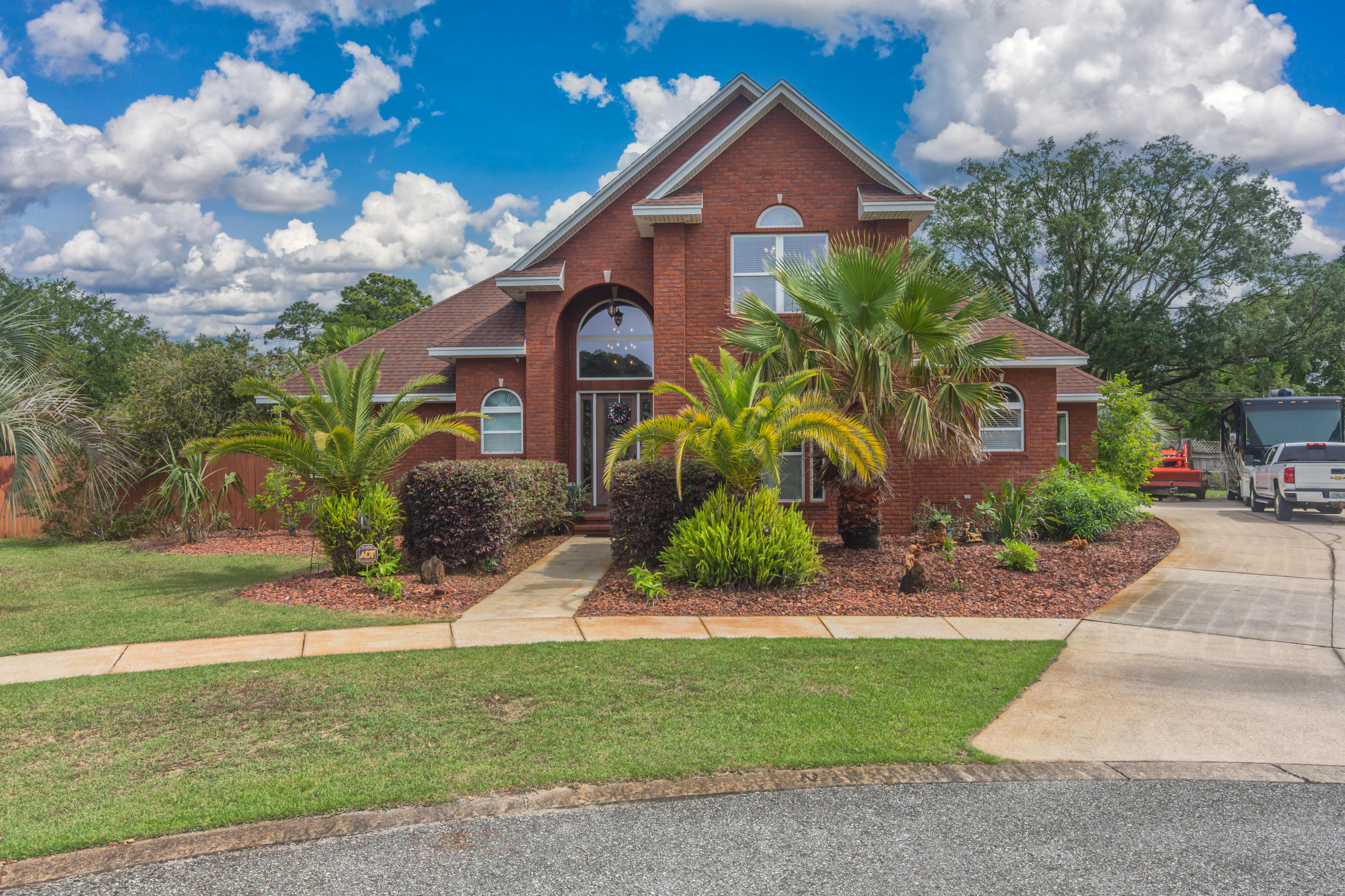 Taking back up offers. ACT FAST you don't want to miss this one of a kind custom built home located in Bayshore Place and sitting on over a half acre lot. From the moment you step inside, you will see the many unique features that sets this home apart from the others, such as the beautiful travertine Compass Rose that points directly north (towards a fabulous backyard oasis!) The lush backyard features a resort style 45,000 gallon zero-entry saltwater pool, with pebble tech bottom, and sunning area. Outback you will find a built in fire pit and a separate fenced grassy area with an array of fruit trees & natural landscapes. Spacious living is defined with the open-concept living room featuring a gas fireplace, travertine flooring and built in media space.