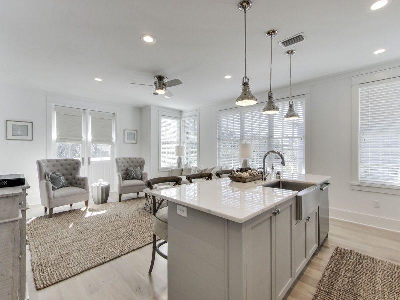 Beautiful newly-updated cottage in the heart of Rosemary Beach with BRAND NEW CARRIAGE HOUSE.Situated just steps from the Cabana Pool, this property is an excellent rental performer and is being offered fully-furnished and in excellent turn-key condition.As you enter the home, you are greeted by an inviting, open area which includes the dining room, living room, and kitchen. You'll find the hardwood floors warm and inviting. The kitchen is professionally equipped with granite counter tops, stainless steel appliances, and all the supplies you need to begin renting immediately. The living room is open and spacious with cozy seating and is complete with a flat screen TV.