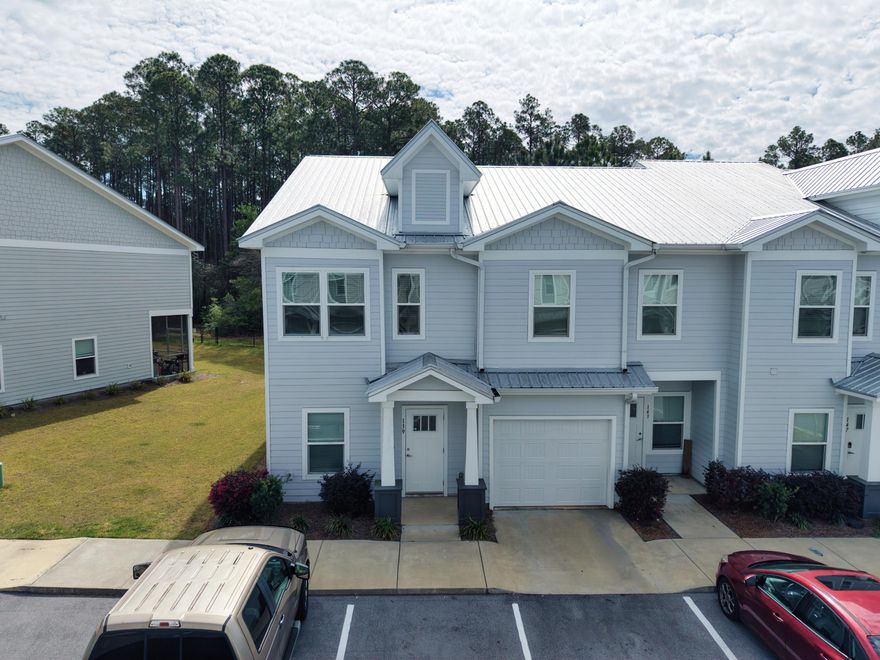 Welcome to 139 Date Palm Lane, located in the Verandas at Freeport community in Freeport. Built in 2023, this well-maintained two-story townhome offers approximately 1,500 square feet of living space with 3 bedrooms and 2.5 bathrooms. The home features a functional open-concept floor plan where the kitchen flows directly into the dining and living areas, creating an ideal layout for everyday living and entertaining. Large windows allow plenty of natural light to fill the main living space, giving the home a bright and welcoming feel.The kitchen is designed with both style and practicality in mind and includes quartz countertops, modern cabinetry, stainless steel appliances, and a spacious island with bar seating that provides additional prep space and a casual place to gather. The main floor also includes a convenient half bath and direct access to the back patio area, making it easy to step outside and enjoy the peaceful surroundings of the community.

Upstairs, the primary suite offers a comfortable retreat with a spacious bedroom, walk-in closet, and a private bathroom featuring dual vanities and a walk-in shower. Two additional bedrooms provide flexibility for guests, family members, or a home office, while the second full bathroom is centrally located for convenience. The upstairs layout offers a practical separation between the main living area and the sleeping quarters.

As part of the Verandas community, residents enjoy neighborhood amenities including a community pool, pickleball courts, and a playground, all designed to enhance the neighborhood lifestyle. The location offers quick access to local schools, grocery stores, and shopping throughout Freeport while still being within a short drive of the white sand beaches and coastal communities along 30A and the scenic shoreline of Choctawhatchee Bay.

139 Date Palm Lane presents an excellent opportunity to own a newer construction home in one of the Emerald Coast's fastest-growing areas, offering modern finishes, low-maintenance living, and a convenient location close to both everyday amenities and the beautiful Gulf Coast beaches.
