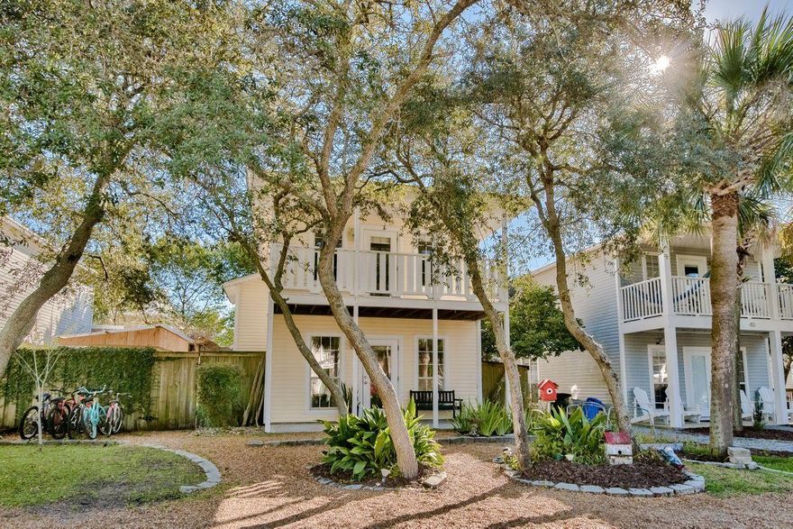 Tucked away behind shady greenery, this two-story home is the epitome of tranquil living just minutes from the emerald Gulf and white sandy beach. Designed for enjoying an outdoor Florida lifestyle, this single-family home has a first floor porch and upper balcony. The glass entrance door leads directly into a light-filled living room, courtesy of the full-height sash windows. Luxury wood-effect vinyl flooring combines practicality with refinement in the main living and dining areas. A neat recess provides a cozy sitting area for enjoying your favorite movies on a wall-mounted TV within a rustic media stand. The kitchen area includes a generous breakfast bar for casual dining. There's a separate pantry and a useful laundry room tucked behind a sliding barn door. Stairs lead up two bedrooms including a generously sized master suite. A door leads directly onto the balcony, the perfect place to greet each day while nursing a cup of coffee. The private yard to the rear is a bonus for those who dream of a place to chill that requires zero garden maintenance. There's an inviting decked area beneath a shady pergola - perfect for relaxing at the end of the day with a glass of wine. A storage shed in the back provides ample hobby and storage space. Just a three-minute walk from beautiful Blue Mountain Beach, this practical home is ideal as a full-time residence or investment. Leisure time can be spent swimming or strolling on the beach spotting dolphins, pelicans and turtle-tracks. Big Redfish Lake is just as convenient for kayaking, fishing and birding on this rare coastal dune lake. With Gulf Place Town Center just two miles west, this well-located home has everything on its doorstep.