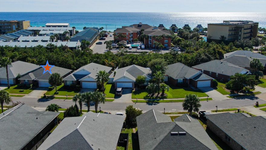 Beachside Gated Community with 320' of Private Beach and North & South Entrance Gates. This lovely low maintenance 1 story brick, 3 bed/2 bath home has wood look porcelain tile floors throughout the open floor plan. Spacious living & dining area has vaulted ceiling. Kitchen has wood cabinets with Granite countertops & bar. Laundry room near kitchen. Master Suite has a large walk in closet and ensuite bath with dual vanities, garden tub and separate shower. 2 Guest Bedrooms share a full bath. 2 car garage, Patio & Fenced Backyard large enough for a Pool. Only a short distance to  Private Beach on Scenic Gulf Drive. Close to Paved Biking/Pedestrian Path & several Beachfront Restaurants. Don't miss out on an opportunity to live in a Friendly Community in a Great location with Low HOA fees. Sit in your Private, south facing, backyard & listening to the Gulf.