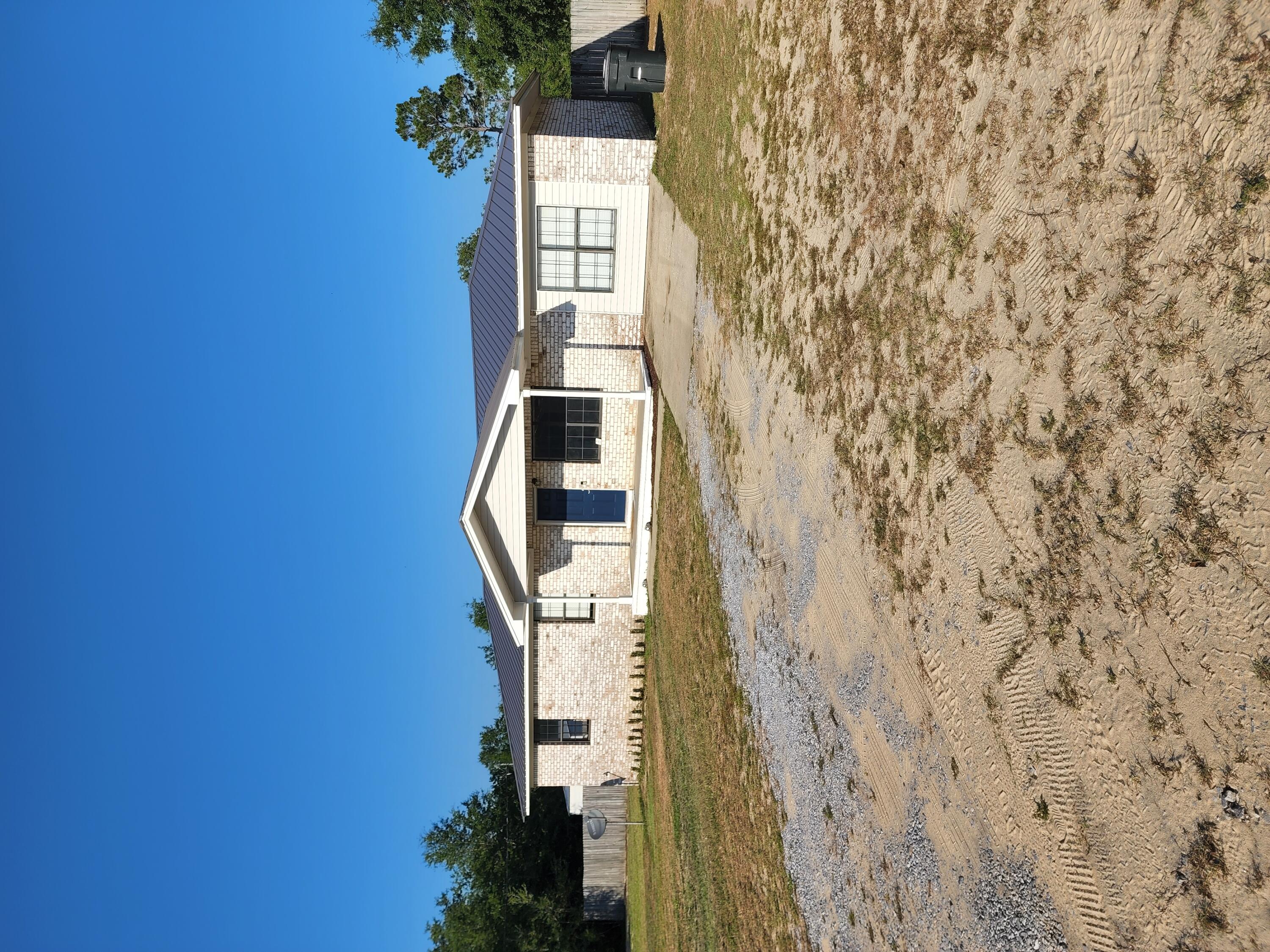 FSBO entered for comps only. Previous carport/garage was converted to masterbedroom by the sellers pior to current sellers. Master was large. Bathroom used to be only a half. Stand up shower was added. New flooring in the bathrooms, new vanities. Kitchen cabinets painted nicely by a professional. Granite counters. Trex deck. Power running to out buildings.