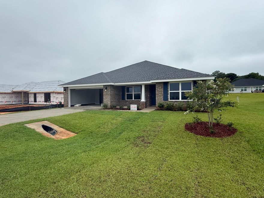 This 4/2 has a lot to offer!  Good sized fully sodded and professionally landscaped lawn.  The 2-car garage comes with electric garage door opener and pull down stairs to the attic. The house is 3 side vinyl with brick front with covered front porch.  This is a split floor plan.  The kitchen overlooks the great room with a separate dining room.  All floors are carpeted except the wet areas which have LVP.  This home is awaiting you to create memories.