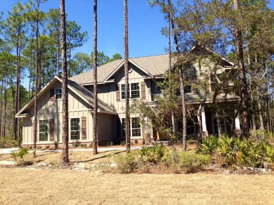 Home reduced $27,250!!!Large lot. Backs up to nature preserve land. Just walking distance from the bay and a few miles from the Beach, Point Washington Estates is located in a terrific area. Fishermen, boat ramps are near and you have room to expand. Point Washington Estates was formerly platted as The Woods Phase II. Land designated as state forest surrounds Point Washington Estates. Therefore, the community is the only community/homes on the south side of East Point Washington Rd. The community consists of only 21 homes sites that range from .58 acres to 1 acre. Each site is unique and home to large mature Oaks, Magnolias, and Pines. Large sites that allow for additional structures are perfect for home owners who desire space, privacy, and the ability to expand