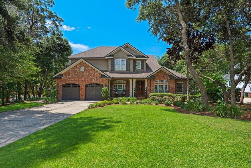 This exquisitely maintained home is located in the desirable community of Swift Creek. Built by award-winning local builder Randy Wise. The home sits on a quiet cul-de-sac and backs up to nature preserve and the community's nature trail. The home features hickory wood flooring, custom made cabinetry, granite countertops, upgraded media with speakers wired throughout, security system with recessed outdoor cameras, and a fully finished basement. Since purchasing the home, the sellers have put in brand new carpet, newly refinished wood flooring, brand new summer kitchen, 3 tankless water heaters and new sod and landscape. Click on ''More'' for additional details. There are so many upgrades including coffered ceilings, bricked fireplace, custom built-in cabinets and book shelves. This home also offers great views from every level. Just off of the great room there are hidden 8 foot sliding doors that open up completely providing beautiful views of the very private nature preserve.  The beautiful eat in kitchen has custom 42 inch solid wood cabinets, granite counter tops, Kenmore Elite oven, built-in microwave, and a duel heat convection stove with a encased stainless steel hood vent.  There are two master bedrooms, one on the main level and a junior master on the second level with an additional guest bedroom on the main level and three more bedrooms on the second level. This home is one of the few in Swift Creek with a completely finished walk-out basement featuring a 577 square foot recreation room that you can convert into a private movie theater. The basement area features a kitchenette, three large storage rooms, a reinforced concrete wall room, hobby room and exercise room.  A covered patio leads out to the landscaped backyard overlooking the nature preserve.  This home is an absolute must see!