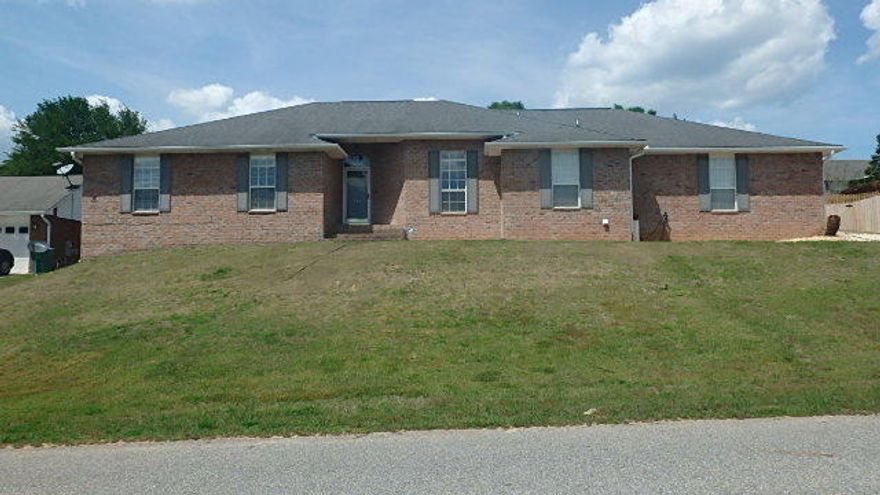 Short Sale (paperwork has been initiated) - Beautiful 3000 sf, 4 bedroom, 2 bathroom home with large Florida Room that sits on 1/3 of an acre for $219,900. Laminate flooring in the living room, dining room, den, kitchen & hallways. The living room has an electric insert fireplace and large wall to accommodate a 72 TV. The kitchen has granite countertops, breakfast bar, stainless steel appliances, deep kitchen sink & pantry. There is also formal dining room with chair-railing. Separate office with French doors. As you enter the heated & cooled Florida room thru the French doors you will notice that it is large enough to accommodate a pool table, darts, play area or just general socializing. The Florida room is included as part of the sf (house 2586, Florida room 414).