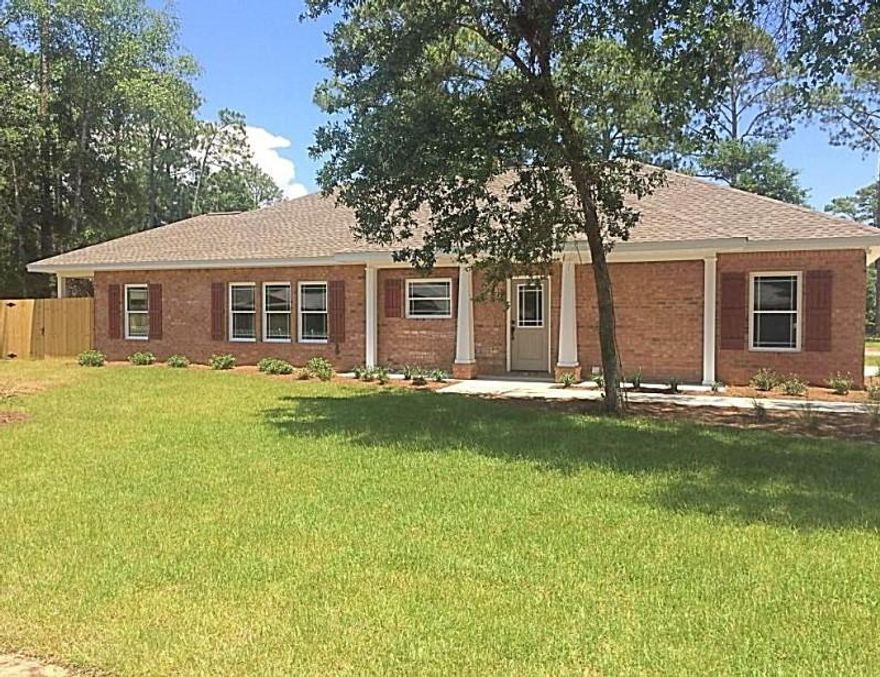 Beautiful like-new brick construction home located in the heart of Niceville, nestled amongst the most established neighborhoods; less than one year old! Completed in 2016 by one of the area's premiere builders; worry-free purchase still under builder's warranty.As you enter through the foyer, be welcomed by a wonderful open-concept floor plan with sight lines to the dining and living rooms. Take pride in a kitchen that features solid granite countertops, a surround of soft-close cabinets, and new stainless steel appliances. A large island with additional cabinetry provides a fantastic focal point for gatherings and entertaining and can support additional seating for dining. Spread out through the dining and living areas with amazing textured laminate flooring underneath.