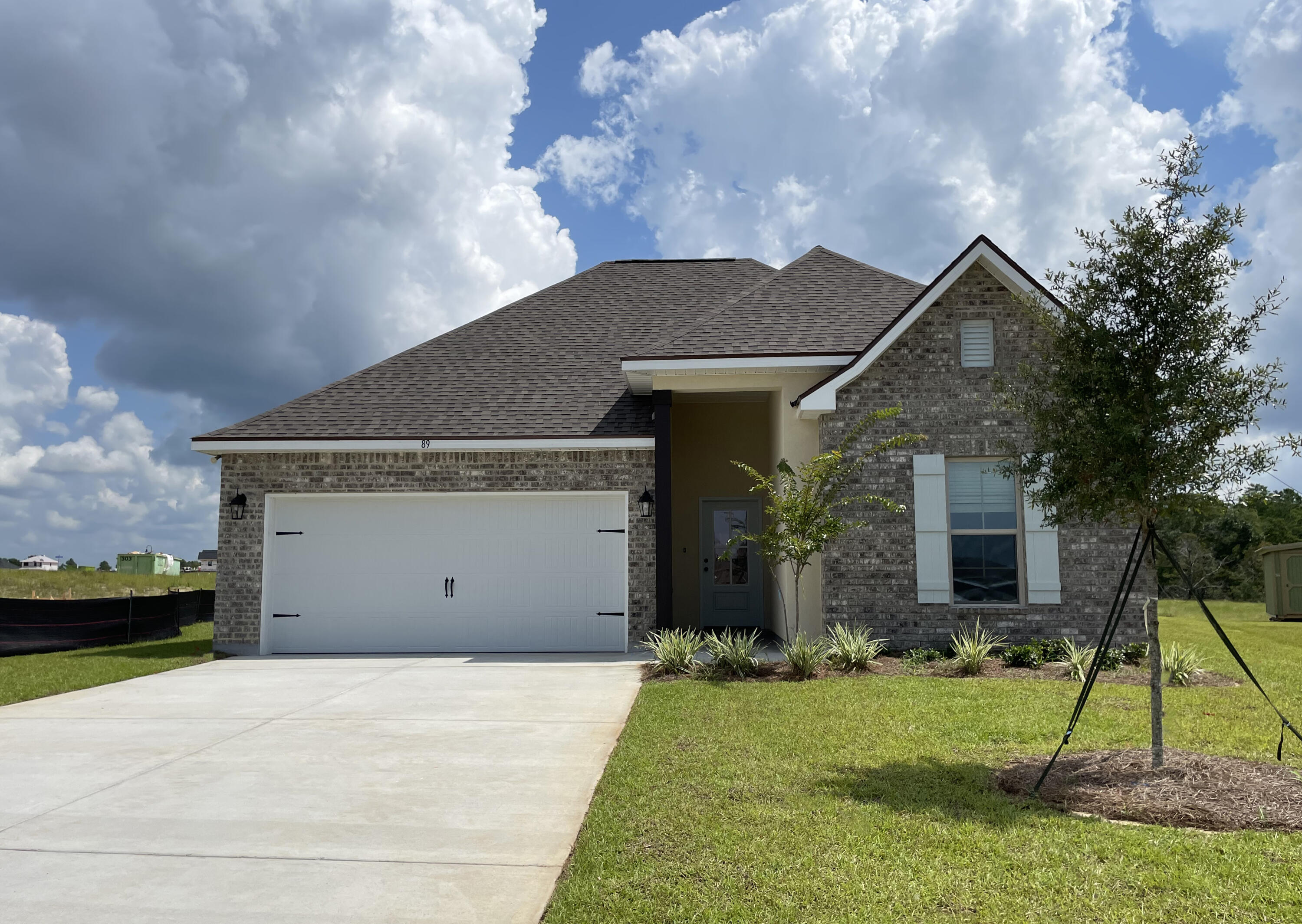 Awesome builder rate incentives and FREE window blinds OR front gutters plus a smart home package (restrictions apply)!The TRILLIUM IV B in The Bluffs at Lafayette community offers a 3 bedroom, 2 full bathroom open and split design. Upgrades added (list attached). Special Features: double vanity, garden tub, separate shower, and walk-in closet in master bath, master closet opens into laundry room for added convenience, kitchen island, walk-in pantry, covered front and rear porches, boot bench in mudroom, recessed lights, crown molding, custom framed mirrors in all bathrooms, undermount sinks, landscaping, architectural 30-year shingles, flood lights, and more! Energy Efficient Features: tankless gas water heater, kitchen appliance package with gas range, vinyl low E windows, and more!