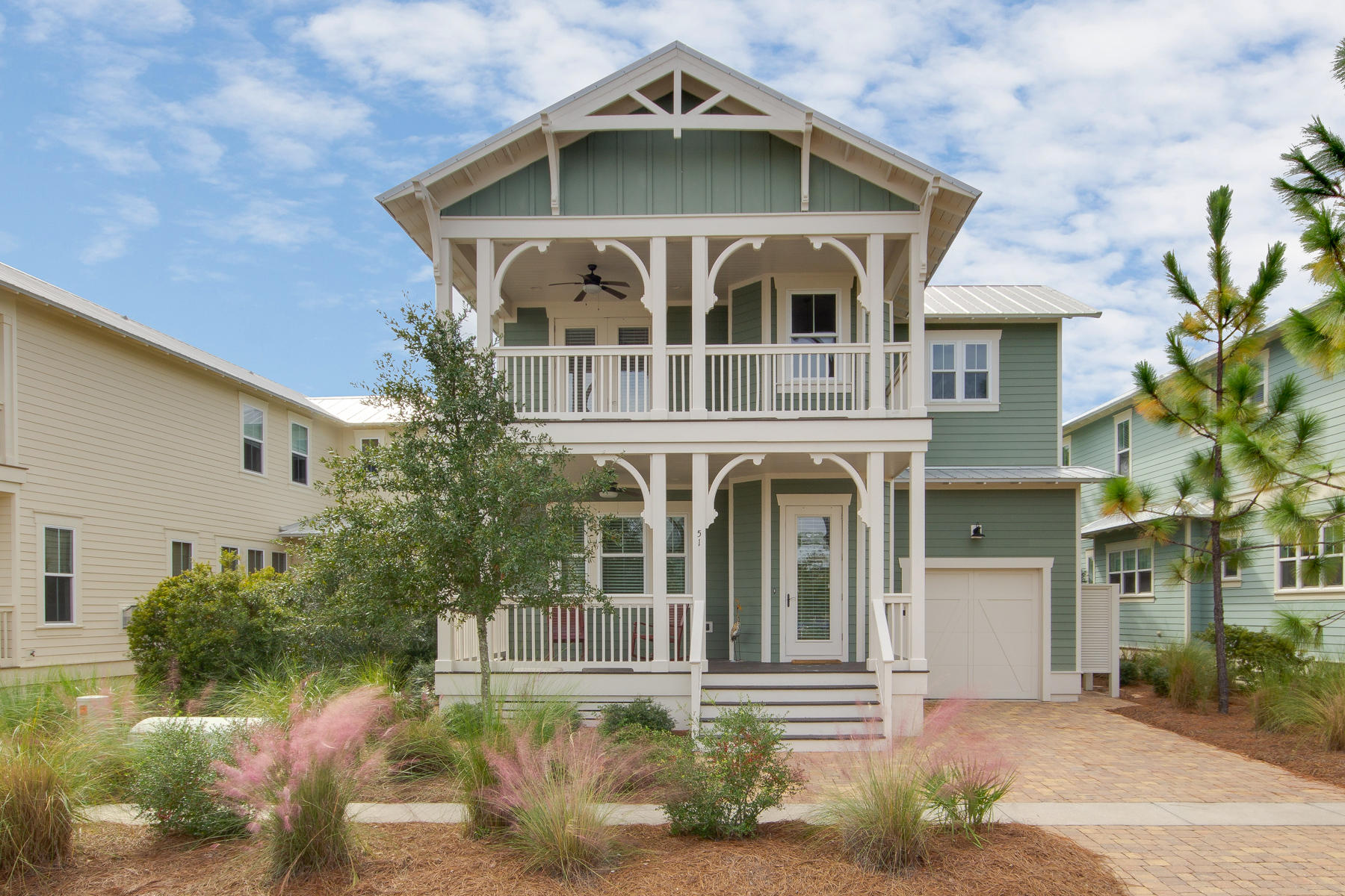 Unique floorplan in NatureWalk at Seagrove. Homes like this do not come on the market frequently here- 3 doors down from boardwalk to pool, close to trail to beach, and situated on a sizeable homesite with gorgeous views (ESP sunset!) This home is offered furnished and has loads of upgrades you won't see in builder inventory- AND has never been rented. Walking in you'll notice dramatic 2 story foyer with guest suite and full bath off to one side. This home opens up into a very spacious, wide open family/ kitchen/ dining area. In the living room you'll find a fireplace with custom built in cabinets surrounding it & gorgeous beamed ceilings with vgroove. Kitchen is well appointed with glass backsplash, built in appliances w/ gas cooktop & spacious island.