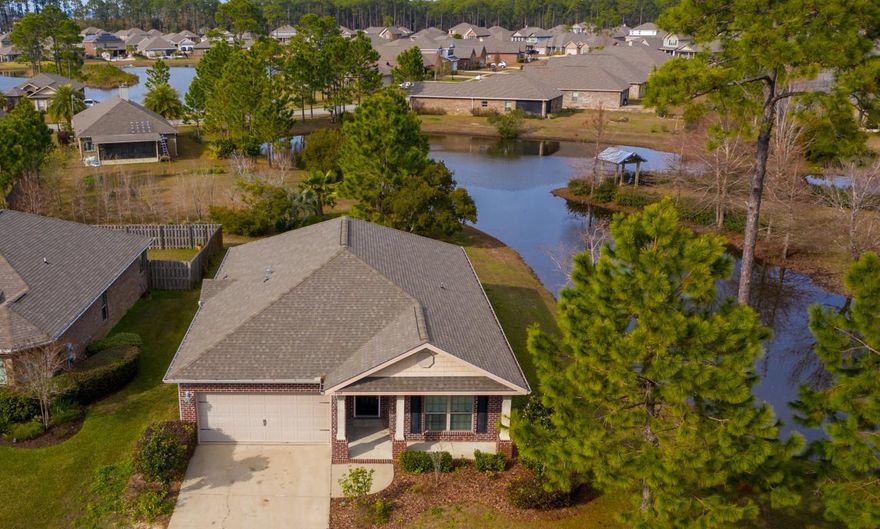 Location, Location! Serene waterfront 3 Bedroom Brick Home plus Office/Bonus/Bunk Room home located on a corner lot in the Bay-front Community of Driftwood Estates within close proximity to the Community Pool and Park! Open floor plan, high ceilings, crown moulding, granite countertops, hardwood floors, new carpet, new paint, new kitchen range, 2 car garage, kitchen pantry, breakfast bar, master bathroom double vanity, tub, separate shower, and large walk-in closet! Enjoy the wonderful views and ambiance during your backyard BBQ's! The Driftwood Estates Community Center includes basketball courts, a soccer field, multiple playgrounds and much more! Within a short drive is the Publix Shopping Center, Grand Boulevard, Baytowne Wharf, Scenic 30A and the beautiful beaches of the Emerald Coast!