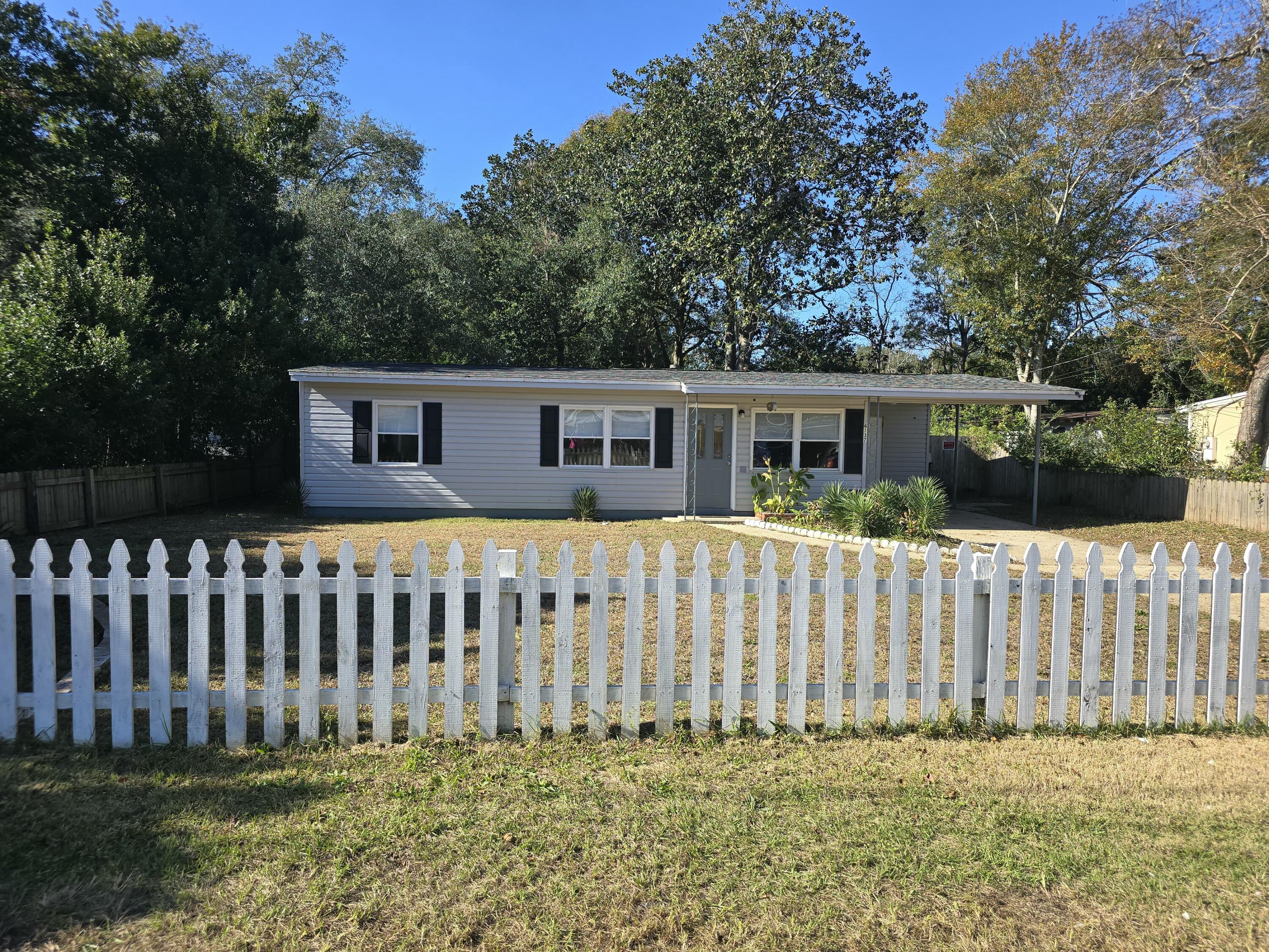 Conveniently located close to dining, shopping, schools, and just minutes from Whiting Field! The welcoming, picket-fenced front lawn adds classic curb appeal.Carport parking for convenience and protection from the Florida sun. Expansive backyard perfect for entertaining, featuring a large shed for storage or projects. A Full privacy-fenced backyard. Cozy fire pit for memorable evenings under the stars. HVAC and ROOF were installed in 2021! Brand-new luxury vinyl flooring throughout with a lifetime warranty.Freshly painted interior--move-in ready! Remodeled bathroom with updated fixtures and finishes.The home was built in 1958, however, with all the updates the effective year built is 2003.