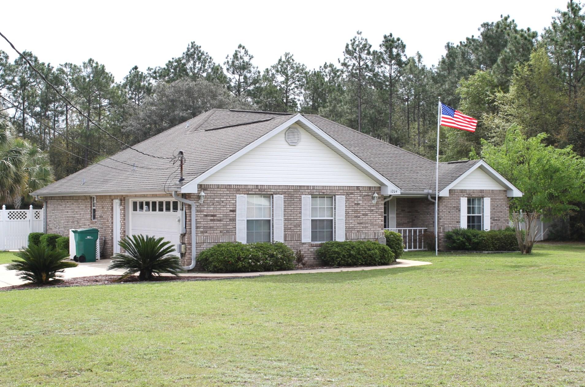 INCREDIBLE all brick 4 bedroom, 2 bath home situated on a private 1 acre lot, with a heated in-ground pool with waterfall, heated/cooled Florida Room and built-in grilling area, perfect for entertaining. Updates include renovated kitchen with Whirlpool Gold Series Stainless Appliances, Granite Counter tops with Breakfast Bar, and custom cabinets. The large master suite is accented with trey ceiling and walk-in closet. The Master bath has a NEW Jacuzzi Tub, Over sized Vanity and a Custom Shower. This home is accented with Custom Trim throughout. The great room is complemented with a wood fireplace and a vaulted ceiling. This home has been completely redone from head to toe. Out back there's a huge shed with car/boat storage area. Home also has Rain bird irrigation system and termite bond.