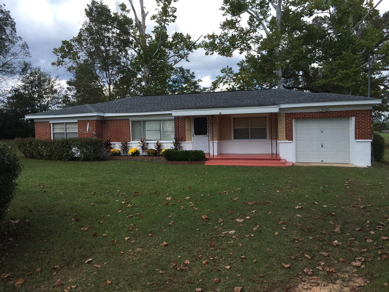 Enjoy living on 21 acres in the country outside of Baker, FL. This country home has been well maintained and is ready for someone to move into. This 3 bedroom, 1 bath home has carport throughout the bedrooms, living room and dining room. Indoor / outdoor carpet is in the kitchen. Vinyl flooring in the laundry room. New tile has been installed on the bathroom floor. Screened in back porch. Home is sold ''AS IS''. Certain items do not convey with sell of home. Small 7 x 7 screened-in porched off the laundry room. Single car garage.