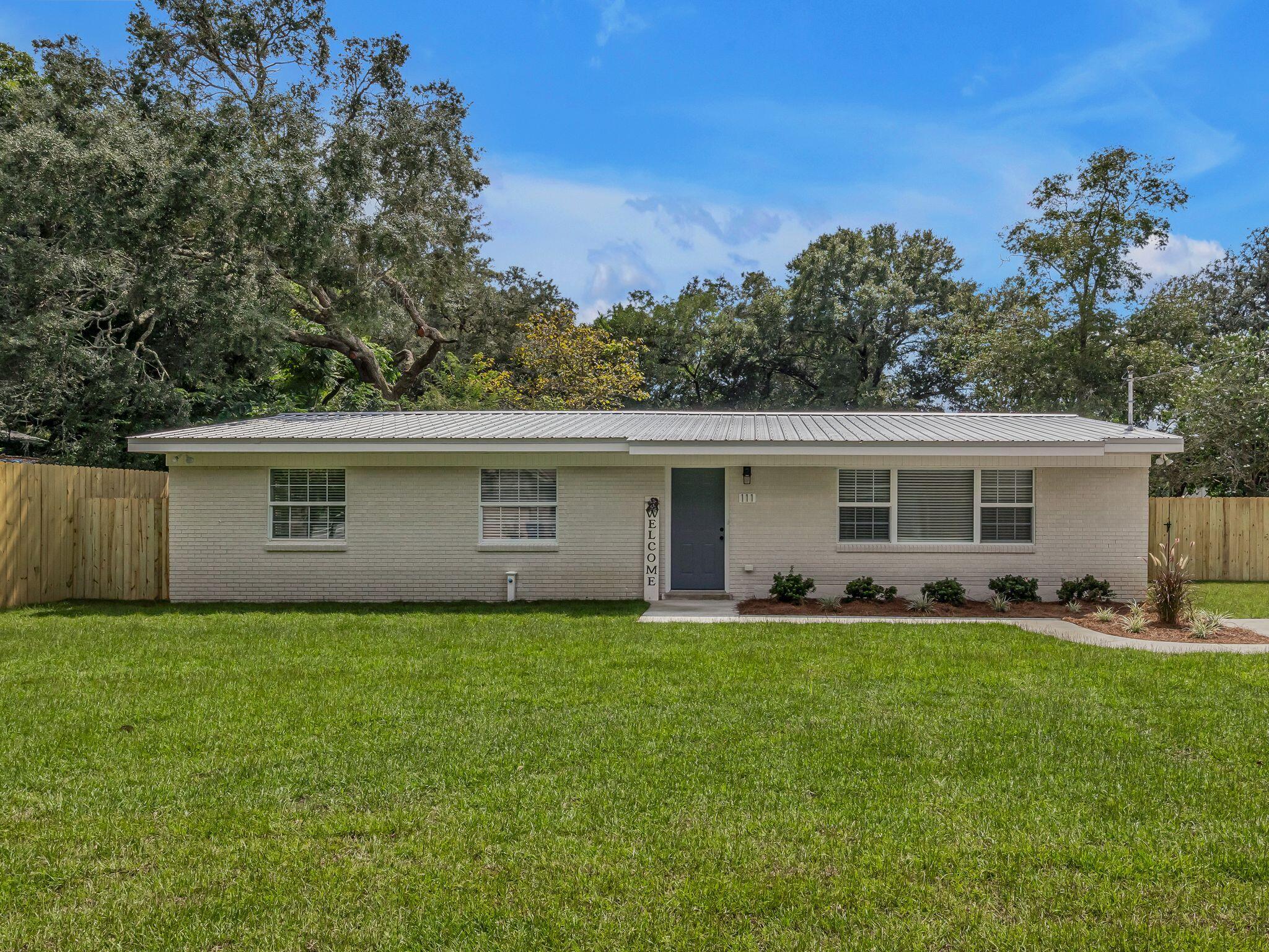 From the moment you pull into the freshly poured driveway you know this home is special. There is plenty of curb appeal with the newly sodded yard, professionally installed sprinkler system and brand new fence! Upon entering the home you will find beautifully refinished hardwood floors, an open great room with lots of space to entertain, a dining area and a breakfast bar. Explore the well planned kitchen with all new appliances, new quiet close cabinets, granite countertops and a stylish pantry with a frosted glass door. Both bathrooms have been beautifully updated as well asl all the fixtures and trim throughout the home. Laundry is a breeze with the conveniently located brand new washer and dryer. Exit the French doors from the dining are to enjoy the enormous back yard! Metal roof installed in 2024, Hvac, heat pump and new duct system installed 2025, tankless gas hot water heater 2025, Full 200-amp electric service upgrade 2025, All copper wiring, PEX plumbing