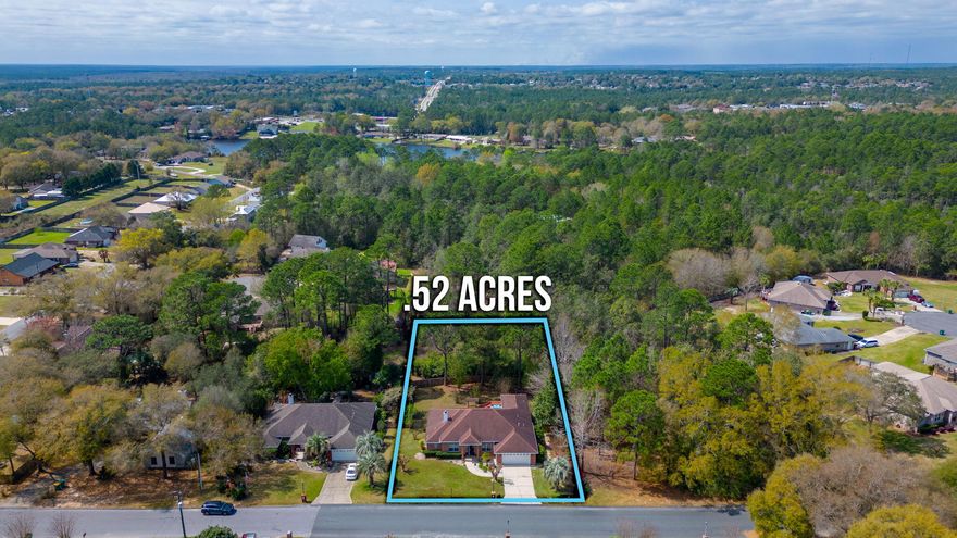 Over half an acre in South Crestview! This 3/3 PLUS FORMAL DINING home has a ton to offer, including a massive fenced in backyard! When you enter in this home you are greeted into a livingroom that features TWO sliding back glass doors that lead out to the expansive back porch and deck. The kitchen offers a breakfast nook, breakfast bar seating, and ample cabinet/countertop space. This home boasts a split floorplan with the master suite that has TWO walk-in closets, a double vanity, soaker tub, and a stand up shower. The additional bedrooms are all spacious as well. This home also has an additional formal dining room. Head out back be prepared to be impressed. The backyard is an oasis with stunning landscaping. Schedule your showing today.