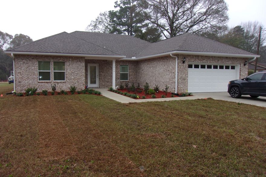 FOR COMP PURPOSES    New construction~ All brick, 3 bedroom, 2 1/2 bath open floor plan~ Quartz counter tops and back splash in the kitchen and granite counter tops in the bathrooms~ Kitchen has smooth top range, stainless steel dishwasher and refrigerator~ Split floor plan~ Screened in back porch, sprinkler system~ Laundry room has laundry sink just off the kitchen~ Conveniently located to shopping, post office and public library~