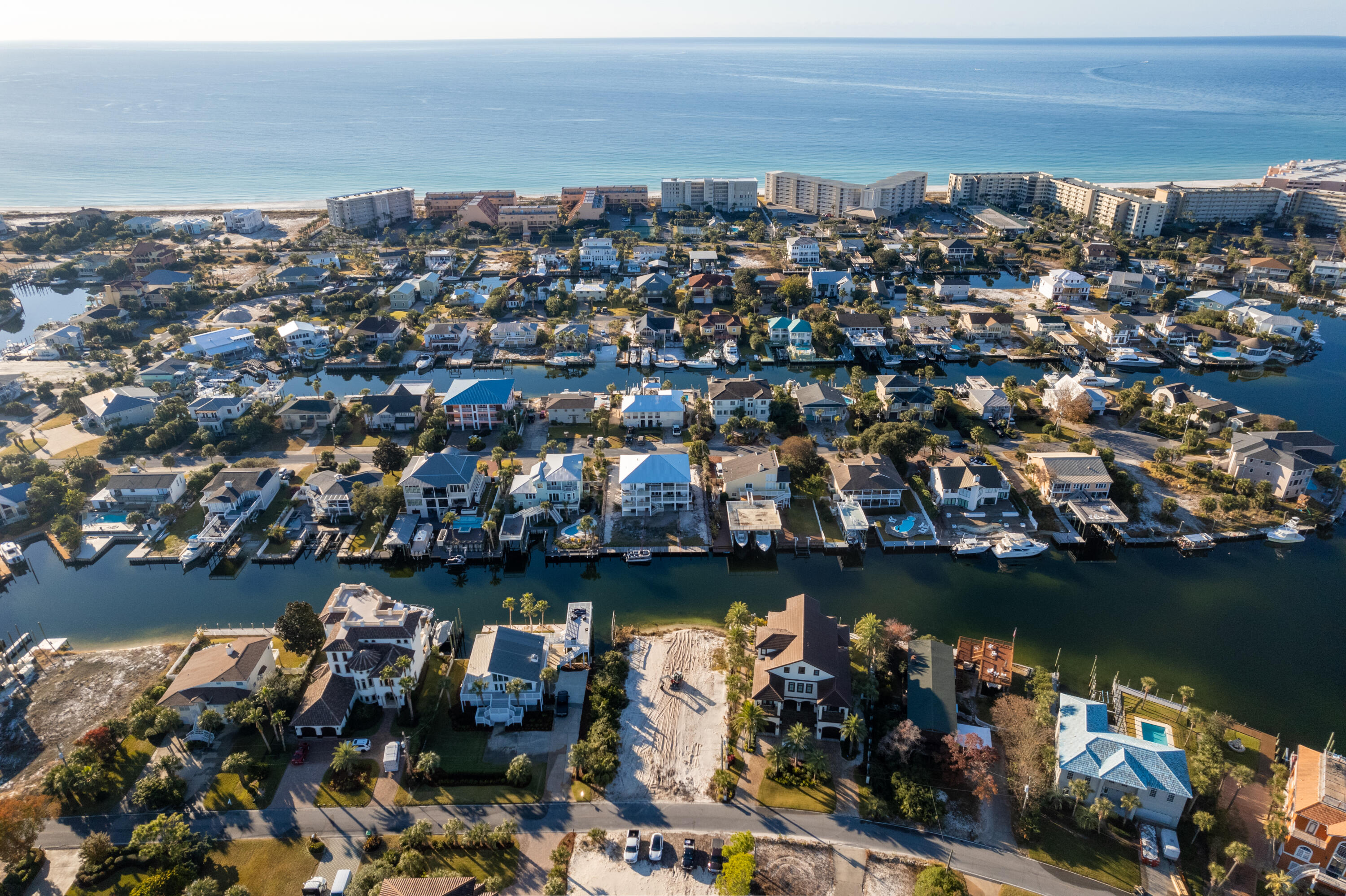 Build your dream home and park your large boat on one of the last vacant lots on Holiday Isle! Take the boat a short ride to the harbor, bay or the Gulf. This deep water lot has been elevated with additional white sand for building. Holiday Isle has the best of both worlds, the beautiful beaches, as well as various boating activities, including Crab Island and fishing. Don't let this one get away!