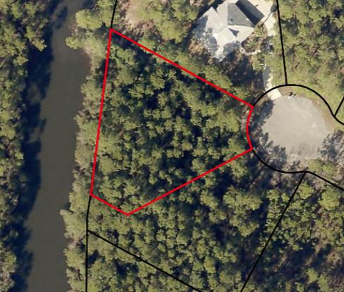 lakefront lot in gated bayside community of sea Pines. Underground utilities and sewer available. Community has bay access with a dock and gazebo.