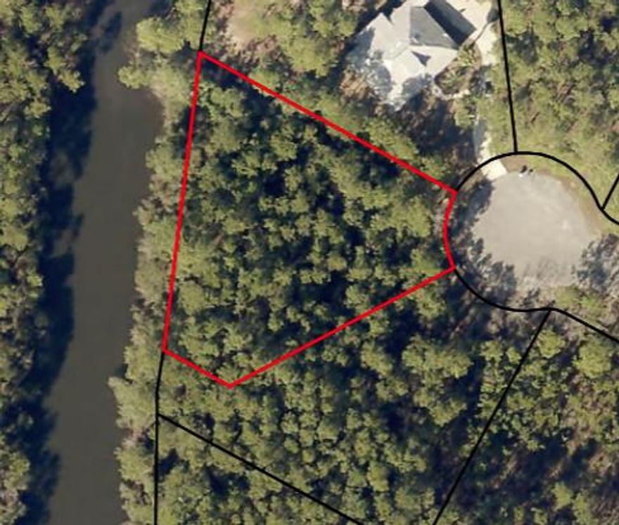lakefront lot in gated bayside community of sea Pines.  Underground utilities and sewer available.  Community has bay access with a dock and gazebo.