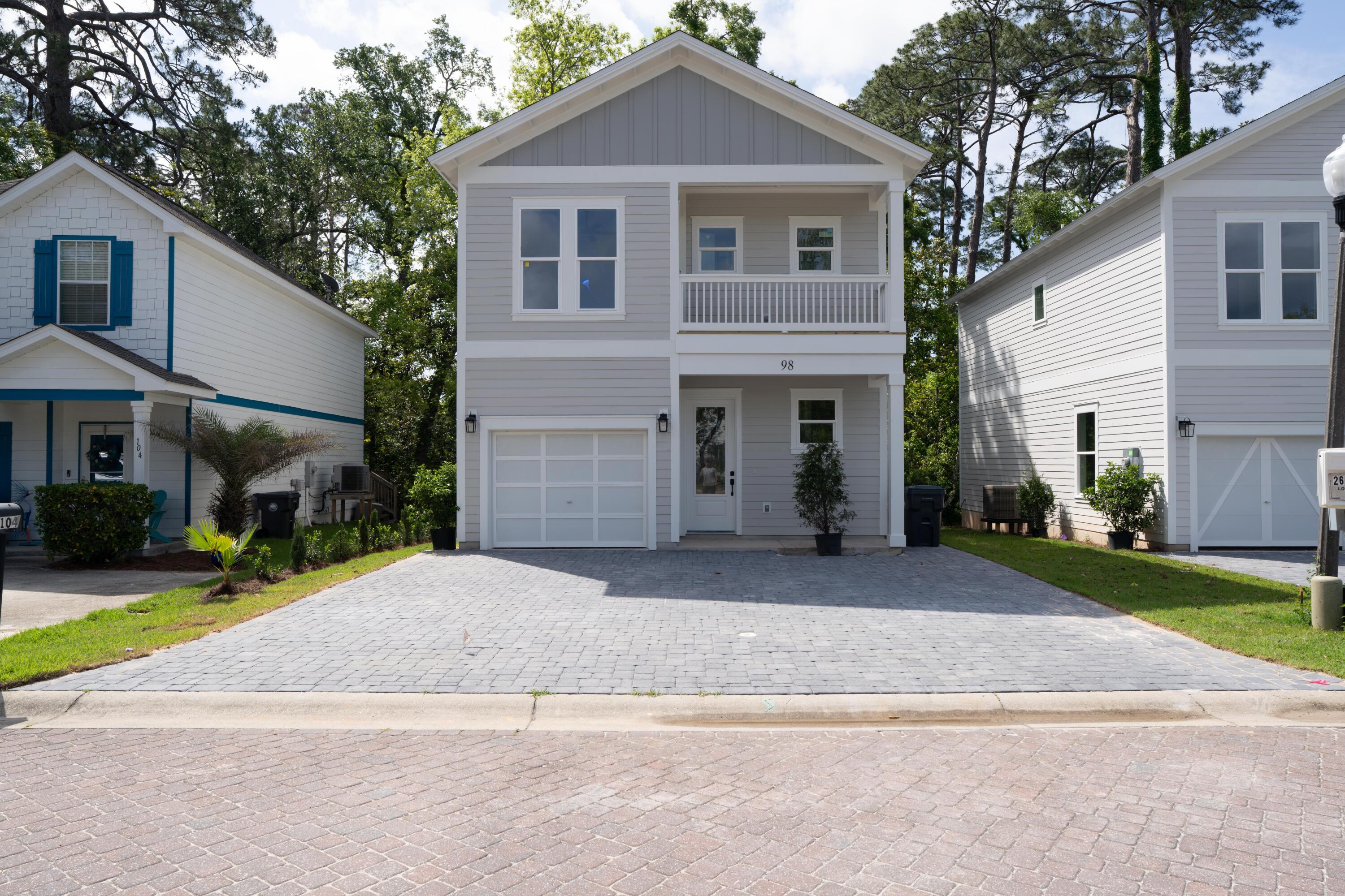 Welcome to this brand-new, beautifully designed 3-bedroom + den, 2.5-bathroom home located in a picturesque subdivision featuring paver-lined roads and exclusive private dock access to the water. Built in 2025, this home combines thoughtful layout, modern style, and high-end finishes in every room.Step into a bright and spacious open-concept living area with a stunning kitchen that boasts upscale cabinetry, luxurious countertops, and top-of-the-line stainless steel appliances--perfect for both everyday cooking and entertaining. The bathrooms feature elegant updated finishes providing a spa-like retreat at home.