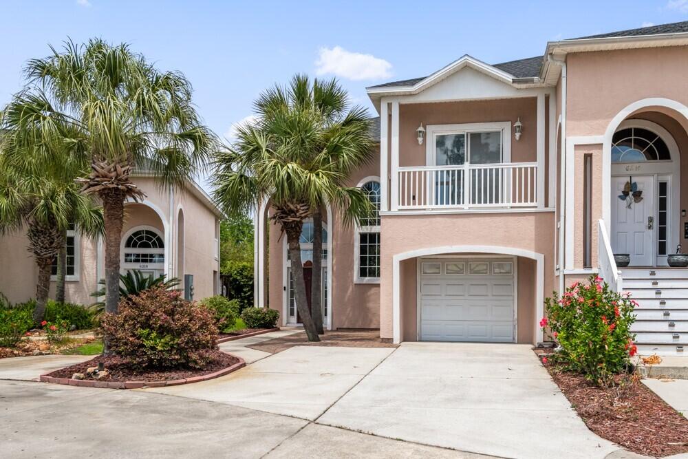 Beautiful End Unit Townhome That Is Spacious And In The Quiet Complex Of Grand Lagoon Villas. This Townhome Is Close To Everything Including The Beaches, Restaurants, Shopping & Marinas. Features Include: Beautiful View of Grand Lagoon From Private Balcony Off Of The Spacious Master Bedroom, Private Open Deck, Large Screened In Patio, Breakfast Bar & Loft Area Big Enough To Use As A Sitting Area Or Office, Single Car Garage, New HVAC (Approx. 1 Year Old) & Much More! Call Today To Arrange Your Private Viewing Of This Residence Today. As Always Buyers To Verify All Information Deemed Important Including: Sqft., Room Dimensions, HOA Fees, Taxes, Etc.