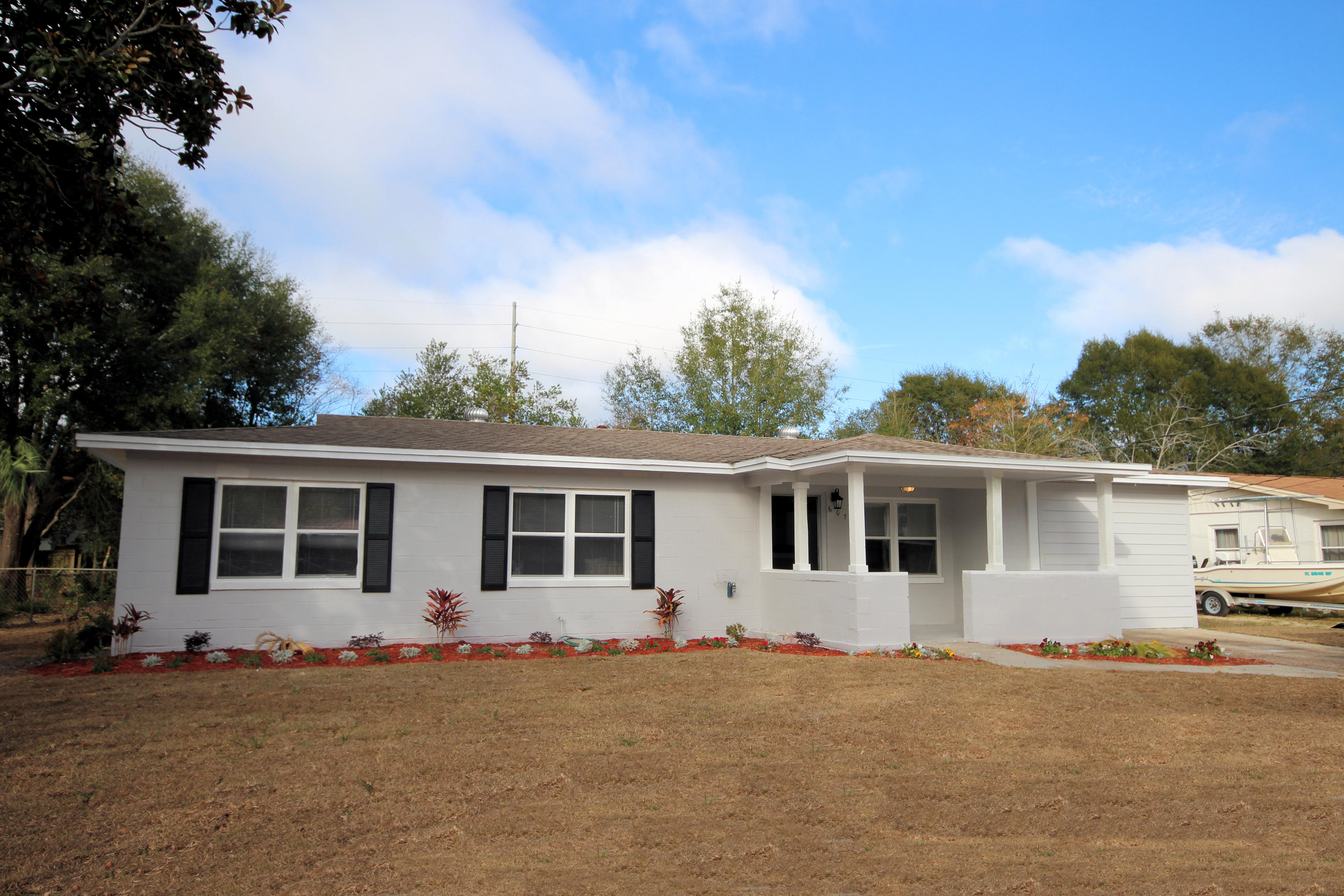 Home Warranty offered by seller!! Fully Renovated and gorgeous 1456 Sq. Ft. home with 3 bedrooms/2 full bathrooms and centrally located with close proximity to beaches, shopping, and the military bases! This home was completely renovated to include the kitchen, bathrooms, lighting, flooring, windows, wiring, and much more! The kitchen features granite countertops with an undermount sink and a subway tile backsplash! The custom, white shaker cabinets with brushed nickel hardware give the kitchen that clean, contemporary look! The 2016 stainless and black stove/oven, dishwasher, and disposal are included. The kitchen opens to a large area for dining! The living room features a custom, built-in entertainment center with shelving, custom wainscoting, new flooring and