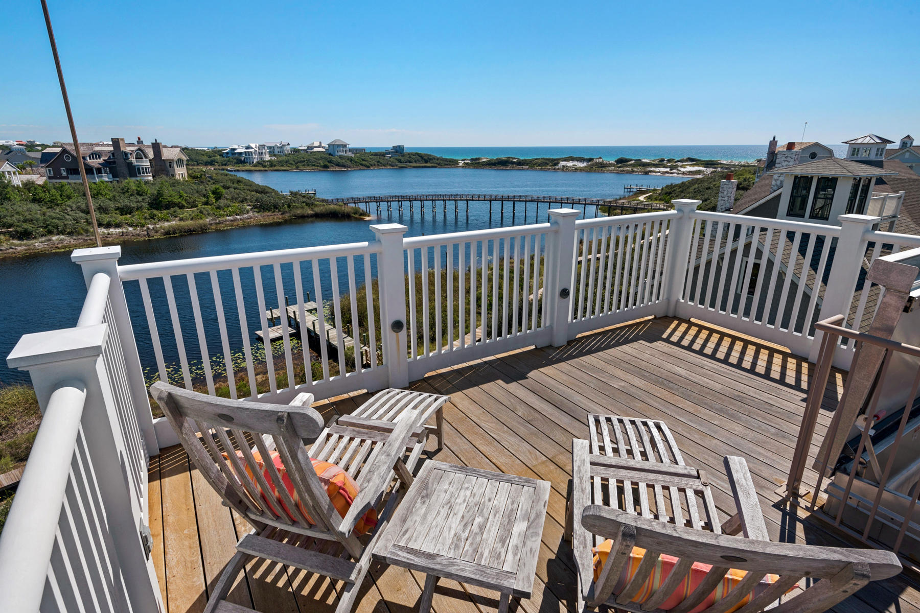 This impeccably appointed waterfront property embraces a unique ambiance where cottage meets class, form meets function and style is always striking. Award-winning Architect Eric Watson and O.B. Laurent Construction exhibit commitment to high quality craftsmanship and design excellence in this meticulously conceived and steel-core constructed resident. Premium accouterments include interior cottage paneling, reclaimed oak flooring, hand-hewn columns and beams, 3-level elevator, outdoor shower, two generously-sized screened porches, geothermal system, towering outdoor brick fireplace, open patios and the finest appliances and fixtures on the market.