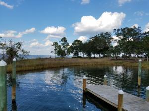 The salt life on the water with breathtaking views of the Choctawhatchee bay and Mack Bayou. Can you imagine waking up to dolphins swimming in your back yard? Jumping in your boat and taking a cruise to your favorite restaurant. Enjoying the sunset from your living room on the water. Imagine how this will change your life. This lot includes a check list of must haves. Sea wall ,Raised elevation,Slip/Dock , All water/sewage/cable on lot hook up tap fees payed for sewage,Paved road ,Gated community and the lifestyle you're looking for. Let's do the math, you save a minimum of $10,000,00 for each included item. That's $60,000 ''included''. See additional Lots and combine your purchased in group. Deep water access. Arboleda Estates community is located only 5 miles to 30A beach access