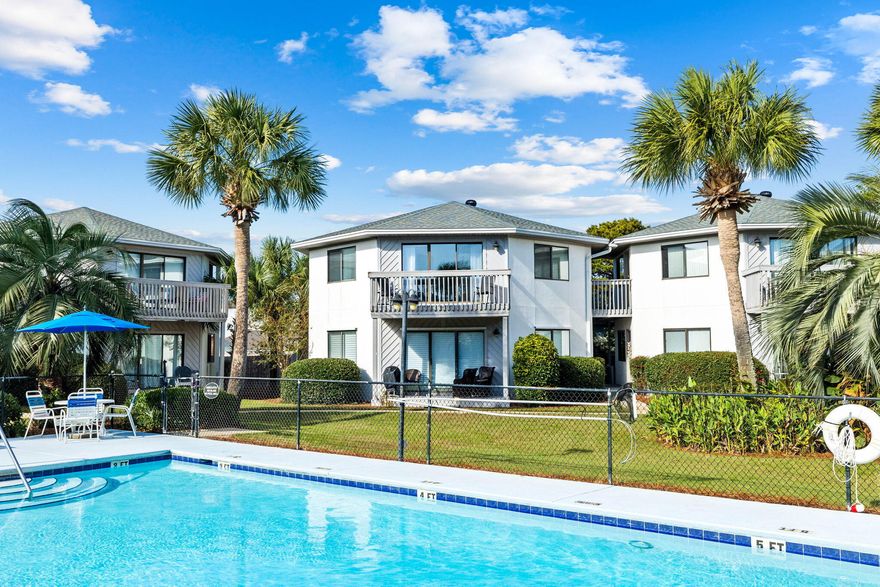 Welcome to your perfect beach getaway in Crystal Village of Miramar Beach, just a short distance from the pristine shores of the Emerald Coast near Pompano Joe's! This beautifully updated second-floor condo offers both style and comfort, boasting a host of upgrades throughout. Enjoy a spacious living area, updated kitchen, white-washed walnut laminate flooring throughout, seamlessly complemented by crown molding in every room--even the bathrooms. Tasteful beadboard accents highlight the kitchen, dining, and living spaces, while a charming shiplap wall adds a touch of coastal elegance.The master suite has been refreshed with a modern vanity featuring soft-close cabinetry, a granite countertop, and a chic vessel sink with a new faucet. Both bathrooms highlight new glass doors, with  with the hall bath enjoying a custom-tiled stand-up shower, built-in tiled seat, and premium glass enclosure. Large custom-framed windows bring abundant light into every room, paired with sleek 2.5-inch blinds in the living areas and 2-inch blinds in the bedrooms for privacy and style.

This unit is offered with all appliances, including a 2019 water heater, 2017 washer/dryer, and 2008 AC. Enjoy your private balcony with scenic views over the pool, perfect for morning coffee or evening relaxation. The well-maintained complex includes two poolsone of which is heated in the winter, just steps from your dooralong with assigned parking, bike racks, and storage options in both the clubhouse and above.

With its prime location near Silver Sands Outlet Mall, popular dining spots, and beach access, this condo is ideal as a vacation home, rental property, or year-round residence. Short-term and long-term rentals are permitted, making it an excellent investment opportunity. Don't miss your chance to own a slice of paradiseschedule a viewing today!