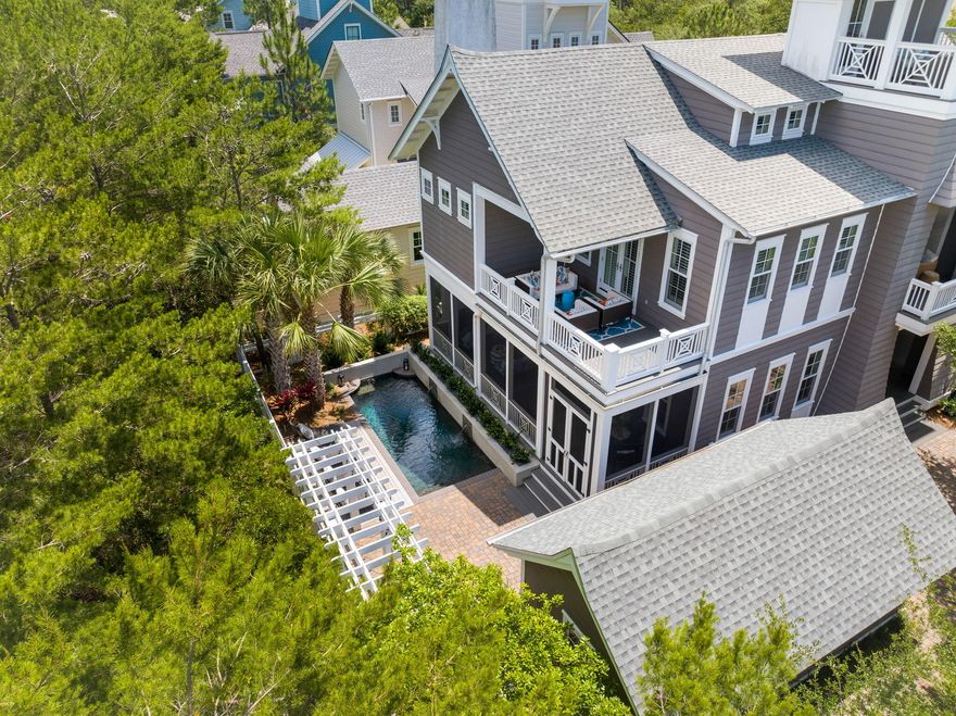 $200,000 PRICE REDUCTION!! Nestled within the prestigious gated Watersound Bridges community this captivating 5-bedroom, 4 1/2-bathroom residence, complete with an office, offers almost 3700 sq ft of thoughtfully crafted living space. Step into the expansive kitchen overlooking the inviting living and dining areas with charming shiplap accents. Outside, discover a screened porch boasting a cozy fireplace, complemented by an outdoor summer  kitchen and a welcoming heated pool--creating an idyllic setting for hosting gatherings and creating cherished memories.Inside, find dual primary bedrooms, one conveniently located on the first floor, in addition to a versatile bunk room and two additional guest bedrooms. Ascend to the third level to savor breathtaking Gulf and serene lake views from the open tower.