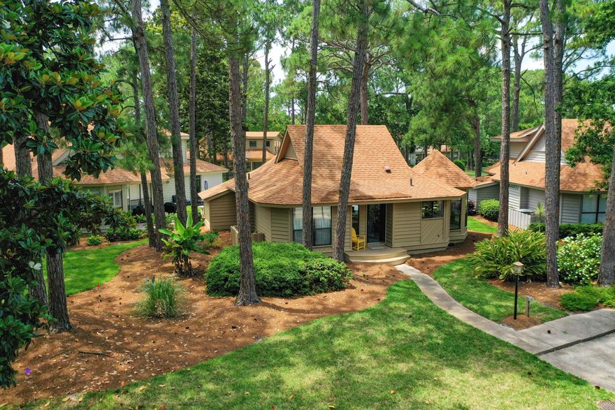 Great opportunity to own the only cottage available in the Fairways with golf course and bay views! No detail has been overlooked in this beautiful remodeled. open-concept coastal chic home. This home is located on a corner lot offering more privacy with lush landscaping. Upon entering you will be impressed with the added shiplap and coastal colors. The kitchen and dining area offers plenty of natural light with ample windows. Some of the features of the kitchen are quartz countertops, island, SS appliances, tile backsplash, under cabinet lighting, upgraded cabinetry, and floating shelves. A newly added custom built-in wine/bar wall unit makes entertaining a breeze! Custom barn door adds privacy to rear bedroom and bath area. Both baths features granite and custom walk-in shower area.