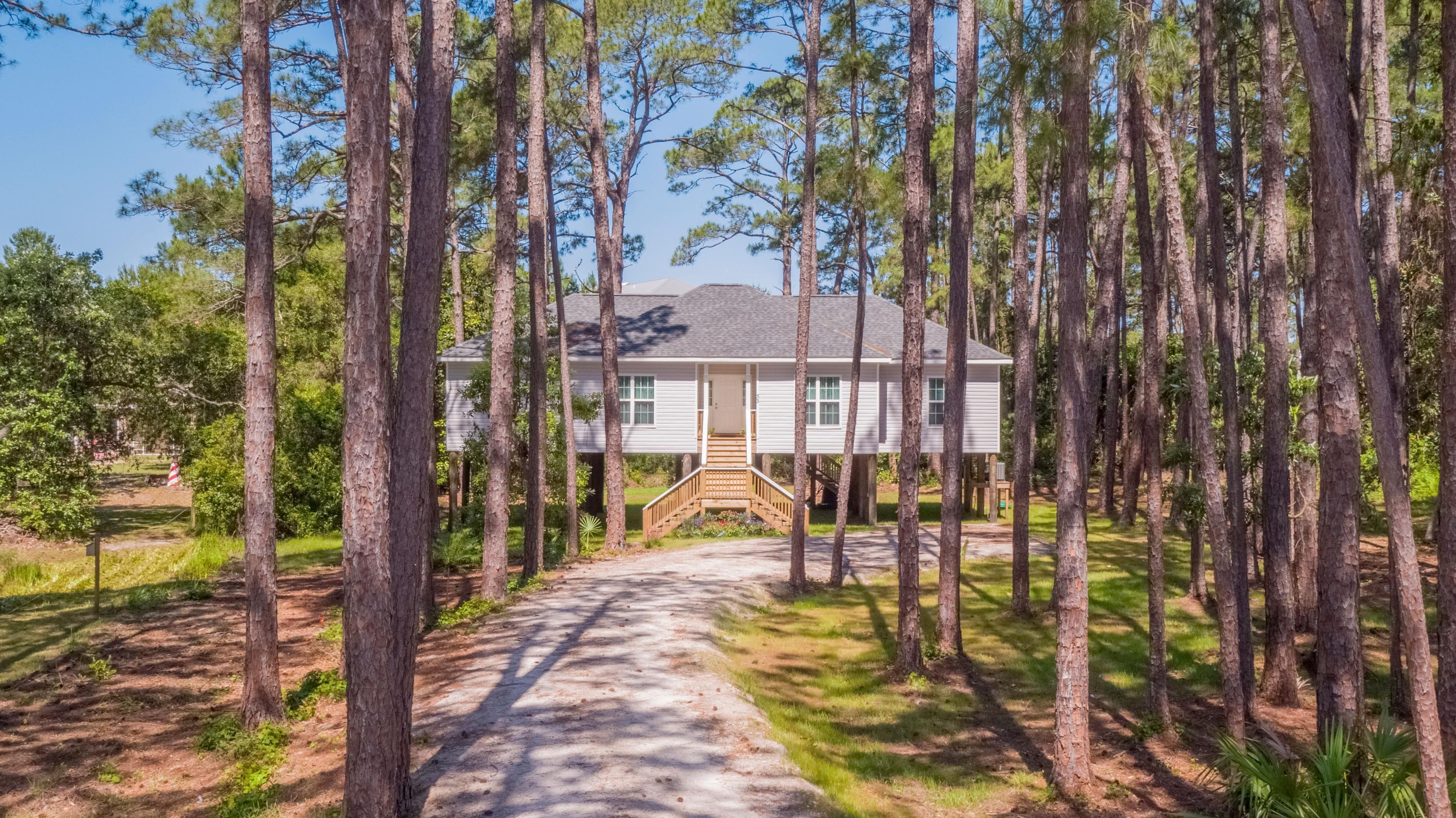 This 3 bedroom, 2 1/2 bath features cathedral ceiling, fireplace, stainless appliances, & granite counters is nestled among lush vegetation and about 1/2 mile stroll to either of two nearby beach accesses. Conveys fully furnished and move in ready. Consists of 2 lots to make 0.67 acres. Survey and Floorplan under Documents. Matterport Camera in Photos. Prospective Buyers and their Agents should confirm all information to their satisfaction.