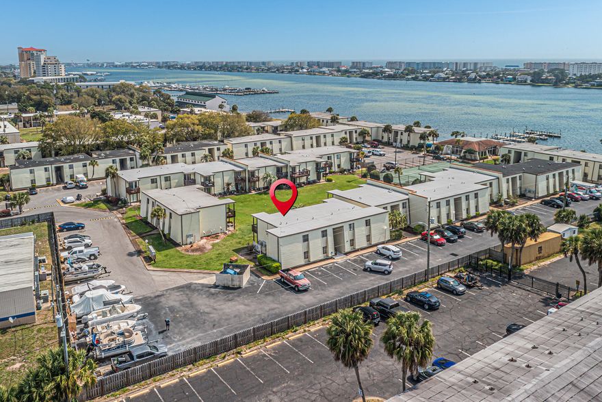 REMODELED turn-key 2 bed/ 2 bath unit located at Fountainhead Condos with BOAT SLIP on first come basis. This stunning second floor unit has been tastefully remodeled top to bottom with LVP flooring, fresh paint, updated modern light fixtures, and COPPER WIRING. The kitchen features a Whirlpool STAINLESS STEEL appliance package, QUARTZ countertops, and new white shaker-style cabinetry. The primary bedroom with His & Her closets; En-suite bathroom with walk-in tiled shower, tile flooring, new fixtures, and modern vanity.Additional bedroom with walk-in closet, and the hall bathroom featuring a relaxing tub with tile surround. Off the living room is a private balcony overlooking the grass courtyard. Community tennis, pool and clubhouse overlooks the Santa Rosa Sound.