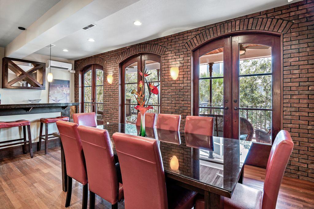 Newly renovated!!! Must be seen to appreciate uniqueness. Located in the heart of the Village of Baytowne and overlooking Main Street with a view of the parades. Only a handful of these ''custom built'' lofts were made available at pre-construction; each one with its own charm. This one offers a particularly spacious living/dining area and a great bar area; perfect for entertaining. On the top floor, there is a master bedroom, large closet with a connecting private bathroom. On the first floor, there are two more guest bedrooms with two bathrooms and an additional bunk room. Currently on the Destin Memories rental program, it generates $55K in gross rentals. It is often rented to gather families and friends for special occasions such as bachelor/bachelorette parties, golf outings.