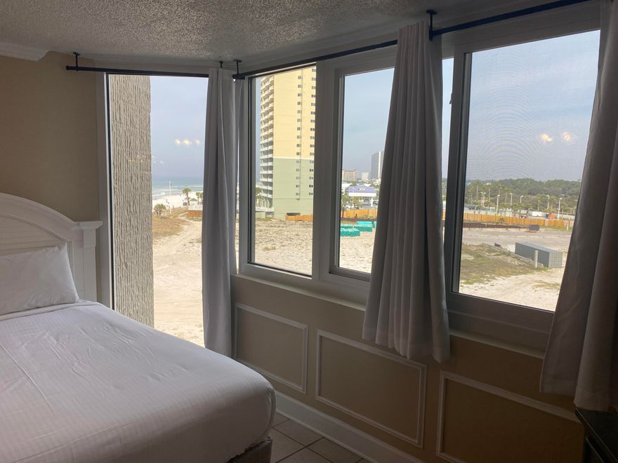 Ocean and Sunset Views. Great condo on the Gulf of Mexico. You cant get a condo any closer to the beach, than at Top of The Gulf!  Live here full time, have it for your friends and family, or use it as a short or long term rental investment. This unit is on the coveted 6th floor.Amenities include a large gulf side pool, kiddie pool, internet lounge, game room, fitness center, BBQ, and picnic areas, beach showers and a poolside snack bar. This complex is owner pet friendly. The association dues are low and include: water, cable, internet, parking and all amenities. Condominium association managers office is on site. This building, is on the Iconic Thomas Drive, that is rich with activities for all!