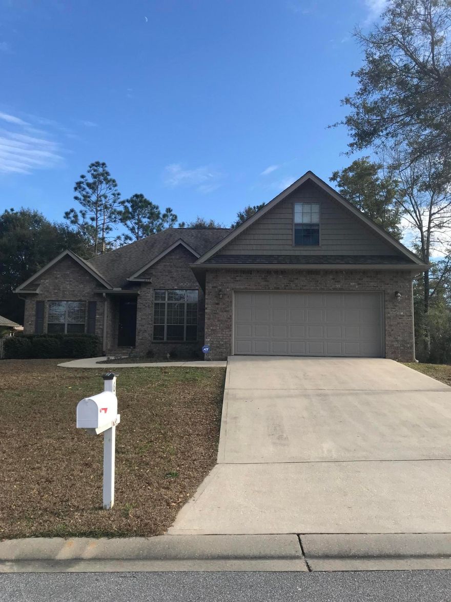 Beautiful all brick home south of Interstate 10. This 4 bedroom, 2.5 bath home includes an office. Kitchen has stainless steel appliances, breakfast bar, pantry and a kitchen island. Split bedroom floor plan. The master bedroom has trey ceilings and a walk in closet. The master bath has a double vanity, garden tub and a separate shower. There is also a screened in porch and a privacy fenced in back yard. Convenient to neighborhood playground,picnic area, military bases, shopping, schools and dining.