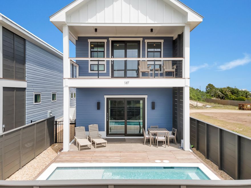 MORTGAGE RATE BUYDOWN! Seller will buy down buyer's interest rate by 2% for first year and 1% for second year. Come see this immaculate new beach house with heated & chilled private pool just steps away from the commercial district and beaches of St. George Island.  This 4 bedroom / 4 full bath two story home completed in 2023 has everything you could want as a private family retreat or rental investment property.  This house is unique to the island in that it is built on a slab with the living area and kitchen on the first floor which opens to the pool and outdoor living area.  Hauling groceries upstairs is a thing of the past.