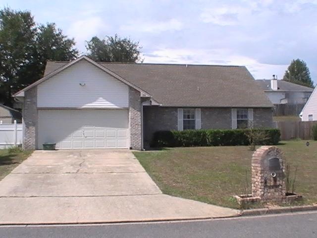 PRICE REDUCED!! Charming home in one of the most sought after neighborhoods in Crestview is just North of I-10 and within 12 minutes of Duke Field and 7th Special Forces duty station. Ideal location, near Wal-Mart and close to all schools and restaurants. The owners have added a screened porch in the back yard along with a new security system. Vaulted ceilings throughout on the second floor with all deep closets and ample storage space. This home is worth seeing. Call today for it will not last long!