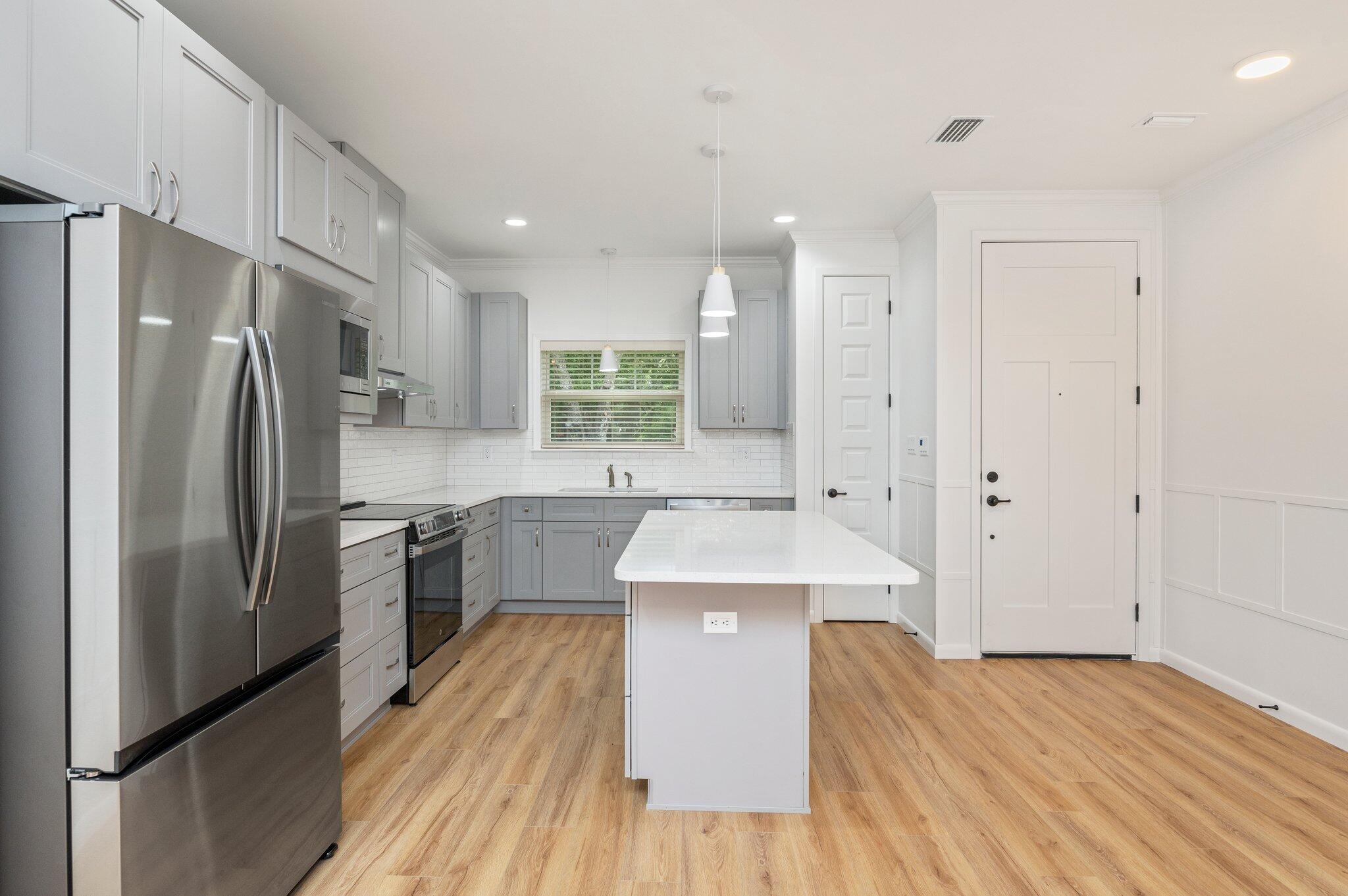 This modern property features 2 bedrooms and 2 bathrooms, perfect for those seeking a comfortable and convenient living space. The interior boasts brand new LVP flooring throughout, high ceilings, and modern fixtures, giving the home a fresh and stylish look. Say goodbye to yard work, as yard care is included with this townhome, allowing you to enjoy the outdoors without the hassle of maintenance. Further enjoyment and privacy can be found in the backyard with an 8 foot privacy fence surrounding. Don't miss out on the opportunity to make this fully updated townhome your new home sweet home. Contact us today for your showing!