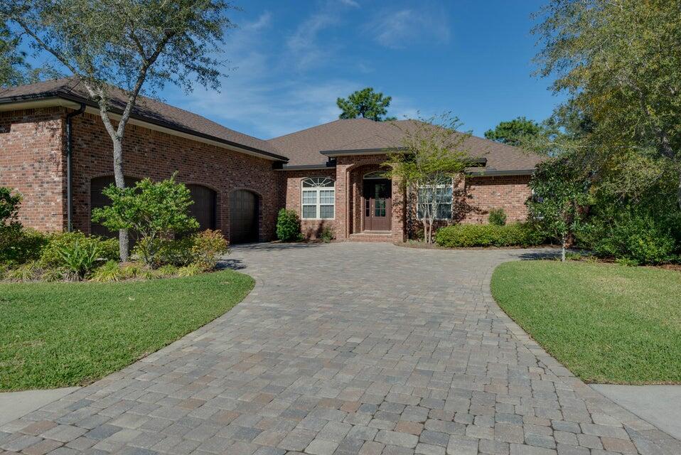 If only the finest will do, this home is an absolute must! Whether it's a huge lot at the back of a cul de sac, the seclusion of the Swift Creek development, or the quality materials in a custom build by builder Gary Miller, 7009 Canopy Creek Cove is a dream location. One tour of this home and you will see that nothing else will compare. This home is beautifully designed, meticulously maintained, and is in excellent condition. What you see with your own eyes, however, is only half the story! Here are some of the carefully selected products that went into this creation that truly makes this home a must have: spray foam insulation for energy efficiency, Rinnai tank less water heater, Upgraded wind package engineered to meet wind load requirements, and oversized three car garage. This owner has completedly redesigned the kitchen to include new cabinets, new countertops, new appliances, and new plumbing fixtures. Sellers removed column pillars in the formal dining room and added brick arches. All new luxury vinyl flooring. All new shiplap wall in great room. Antigue doors added to the master bedroom suite. and if that isn't enough, the outdoor space with kitchen and pool is incredible. Two sets of triple sliders open up to this great outdoor space. This home will amaze any buyer. Come as view this home today.