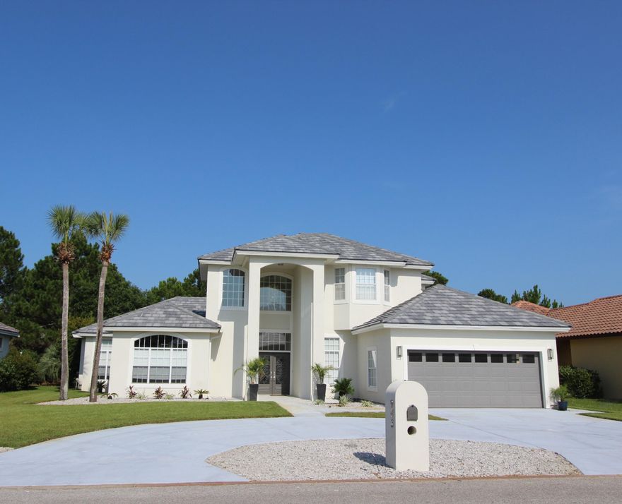 This exquisite home is PRICED TO SELL! Behind the gates of the Emerald Bay Golf and Country Club sits this beautifully updated, contemporary family home. Don't let the age of the home fool you as it underwent a complete renovation in 2013 to include, but not limited to a new tile roof, all new paint inside and outside the home, new landscaping and sod, new hardwood floors throughout the first level of the home, new carpet and tile upstairs, exotic granite countertops throughout, all new designer plumbing and lighting fixtures that are to die for, custom glass back splash and new stainless appliances that are a chef's dream in the kitchen, and new AC in 2015. The floor plan is excellent for family living and entertaining with the Master suite on the main level along with the great room,