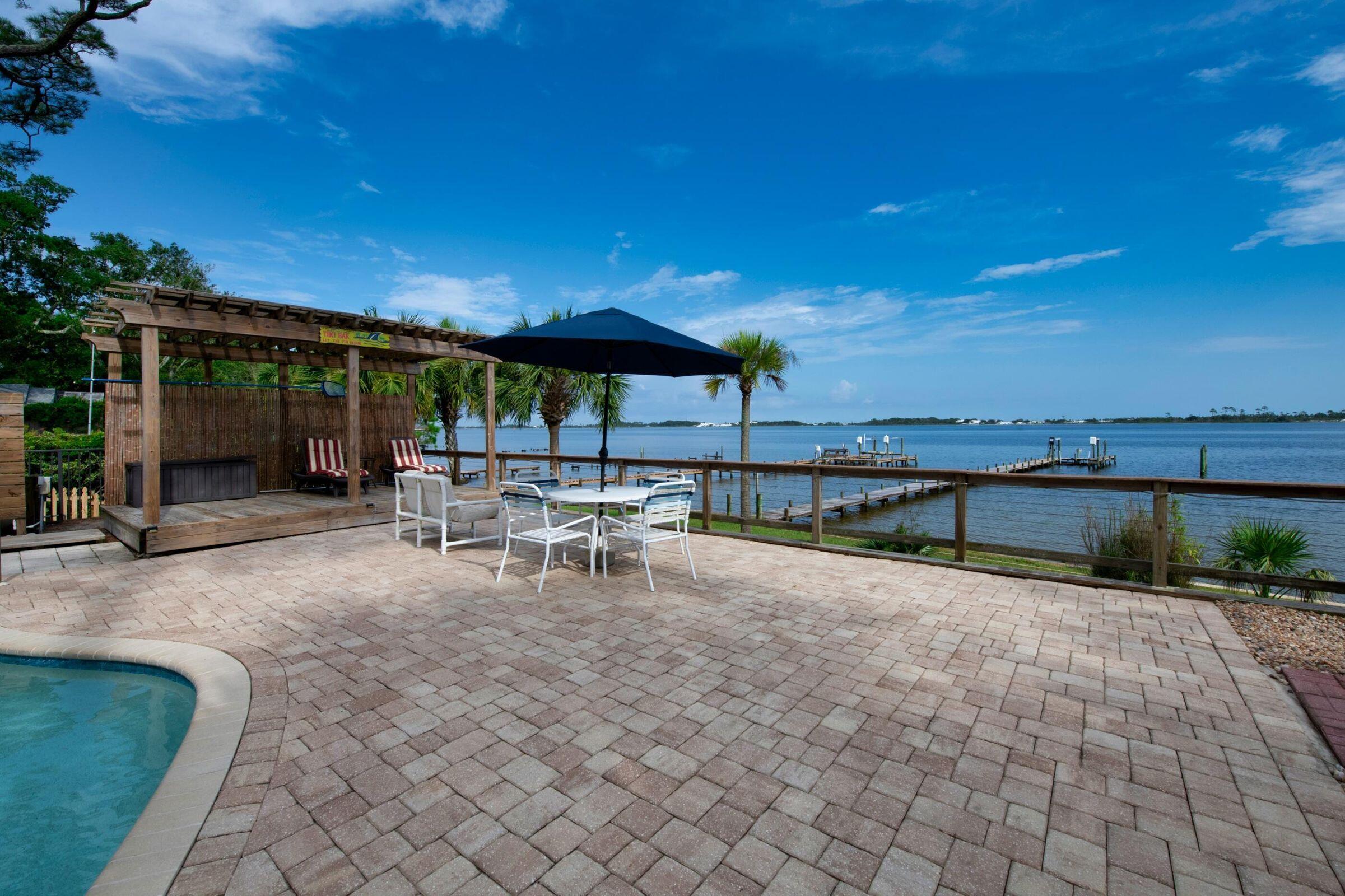 CHARMING BAYFRONT BEACH HOUSE ON THE SANTA ROSA SOUND WITH POOL AND DOCK. Make this home your ''family oasis''; an over-sized and fenced lot featuring green grass and sprawling oak trees provide a serene setting with white sand dunes of the Santa Rosa Sound creating the perfect backdrop. Enjoy days at the private pool which overlooks the water, or fishing and boating from your private dock. Three bedrooms PLUS TWO BONUS ROOMS (could be office or bed space). A portion of the home has what could be a private entrance; perfect for parents-in-law or a young adult to enjoy privacy. Common area is open, yet segmented, providing plenty of charming space to enjoy together or separately. Close by to shopping, dining, beaches, military bases. PETS WITH APPROVAL. DEPOSIT AND REFERENCE REQUIRED.
