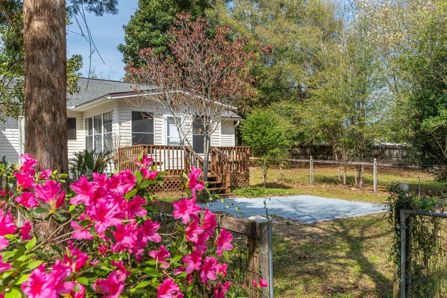 This 3bed/2bath Florida Cottage sitting on a private & fenced 1 acre lot has been completely renovated. The all new interior has a lovely LVP driftwood plank flooring throughout complimenting the gorgeous natural wood ceiling beams. The brand new kitchen has real wood shaker style cabinets, soft close drawers and light quartz countertops with all new appliances, a subway tile backsplash and custom butcher block shelving.  In addition to modern upgraded lighting, natural light floods in through a perfectly positioned window over the deep stainless steel sink looking out to the beautiful oversized backyard.