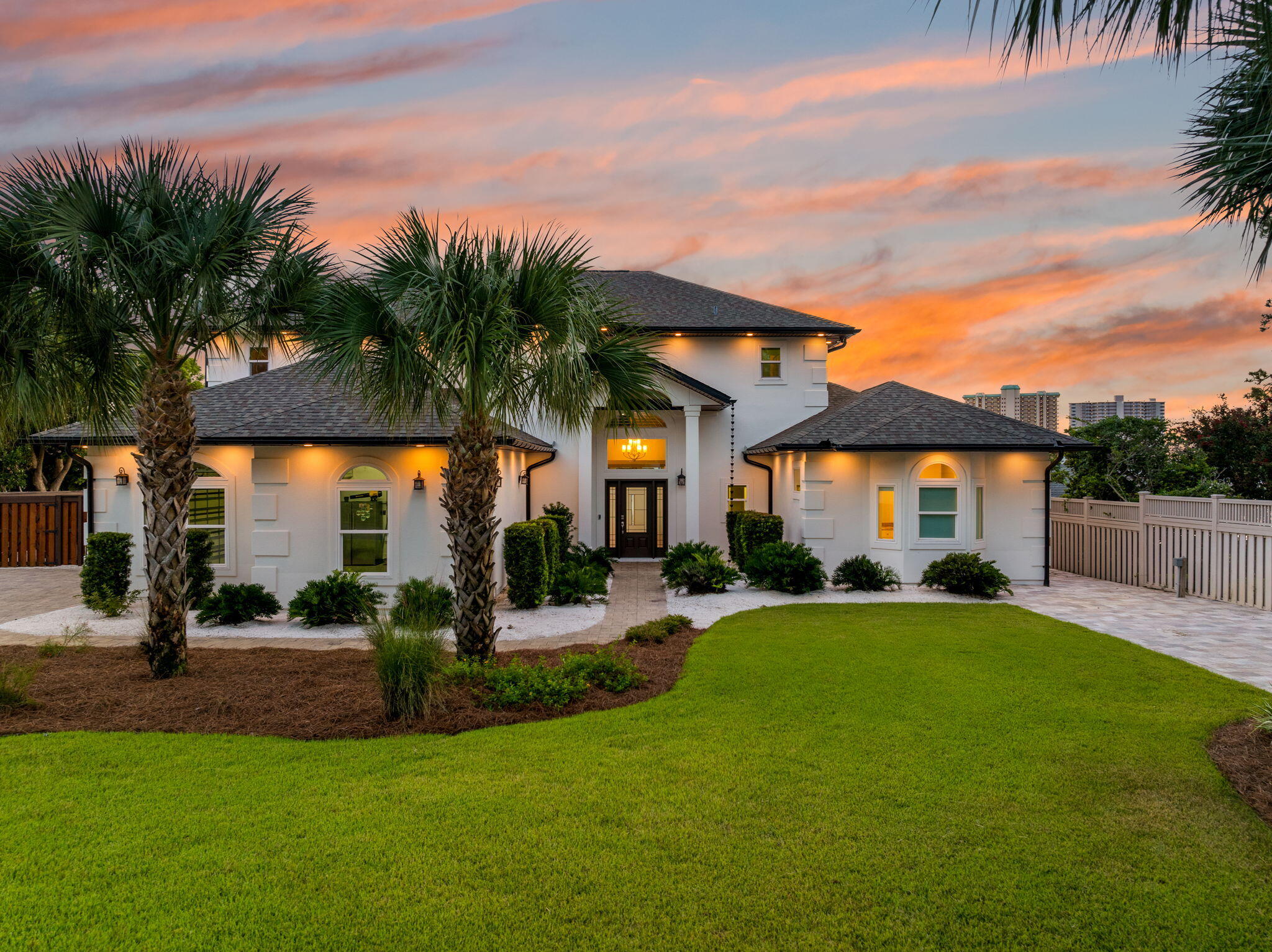 Experience the best of waterfront living in this stunning 4-bedroom, 4.5-bathroom ICF-constructed residence located off North Lagoon. Built with strength and efficiency in mind, the home features all impact-rated doors and windows for peace of mind. Resting on almost half an acre, this property offers rare space, privacy, and unmatched coastal charm. Inside, the open-concept layout flows seamlessly through the main living areas, highlighted by a first-floor master suite with a dedicated 2.5-ton HVAC system designed exclusively for the master. The home is also equipped with geothermal air conditioners, delivering year-round comfort and exceptional energy savings. Step outside to your private paradise a saltwater heated pool with all new equipment, paved backyard entertaining areas , a covered deck, and a rear balcony that captures sweeping water views. A private dock with boat slip and lift ensures effortless access to the water for boating and fishing. Practical upgrades meet luxury at every turn: epoxy-finished garage, solar panels for energy efficiency, and a paver driveway with full hookups dedicated to accommodating a 45-foot RV. This property is the perfect combination of quality, comfort, and coastal lifestyle offering resort-style amenities, top-of-the-line construction, and waterfront access in the heart of Panama City Beach.