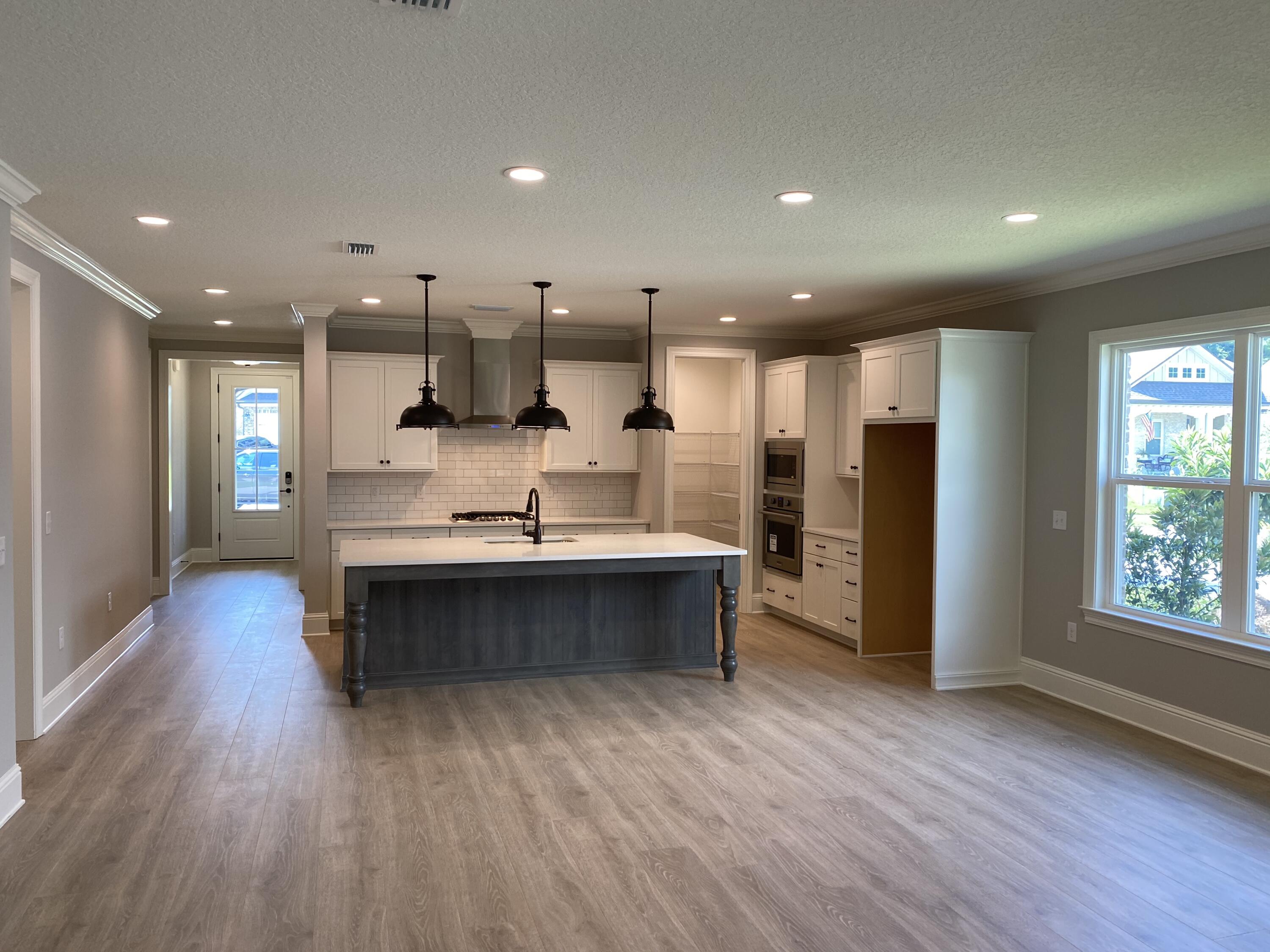 New construction ready for move in by award winning local builder in sought after Osprey Ridge community off Bayshore drive in Niceville. Minutes from Niceville High School and Ruckel Middle School. Home features laminate wood floors throughout with 8' doors, cased windows, crown moulding and 5' base boards. Study with full bath features beautiful French doors. Kitchen is a cooks dream - open to family room with large island, 5 burner gas cooktop, built in oven and built in micro wave with walk in pantry. Master bathroom includes quartz counter tops and large walk in shower with 2 shower heads. Great back yard with room for possible pool and screened porch. This is a rare opportunity!!!