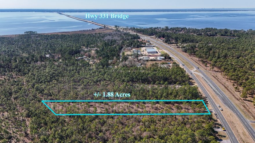 Prime +/- 1.88 ac parcel with 100' of frontage on the east side of Hwy 331S.  This property is between County Hwy 3280 and Choctawhatchee Bay.  Don't miss the chance to invest NOW in the center of pending growth!  Tremendous commercial potential. Currently zoned Rural Village/Mixed Use.  Survey available under Documents.  Buyer to verify all information.