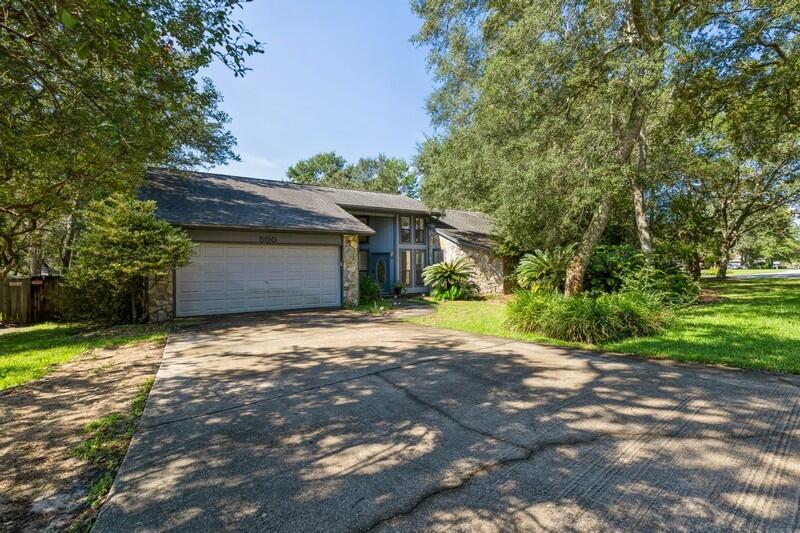 This 3 bedroom 2 bath home is located in the neighborhood of Caribbean Village West, and sits on a large corner lot with beautiful mature trees. It has a large open floor plan with cathedral ceilings in the foyer and great room. The large backyard is perfect for entertaining.Garage still has items in it but will be cleaned out. Home has been a rental and will be sold as-is. Per seller, roof has been replaced, some siding has been replaced, 3 windows have been ordered for replacement, walkways and porches have been power washed and carpet has been cleaned. Buyer to verify any information deemed important.