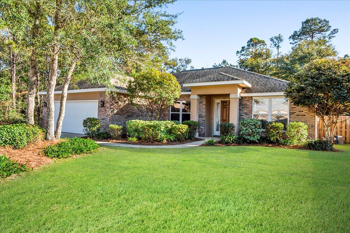Contemporary Classic Plenty of Light in this Split Bedroom and open floor plan. New Flooring , Architectural columns in foyer with 18'' ceramic tile flooring. Tiled Gas Fireplace w/ mantle, Crown Molding, Beautiful Granite Counter tops, Custom Maple Cabinets, Stainless Appliances, Large walk in pantry, Breakfast area, and bar top. Large walk-in laundry room, Master bath has jetted tub. Shower with seat, triple sliding glass door leads out to your spacious rear covered patio,New Privacy fence plus many more beautiful features in this Gem